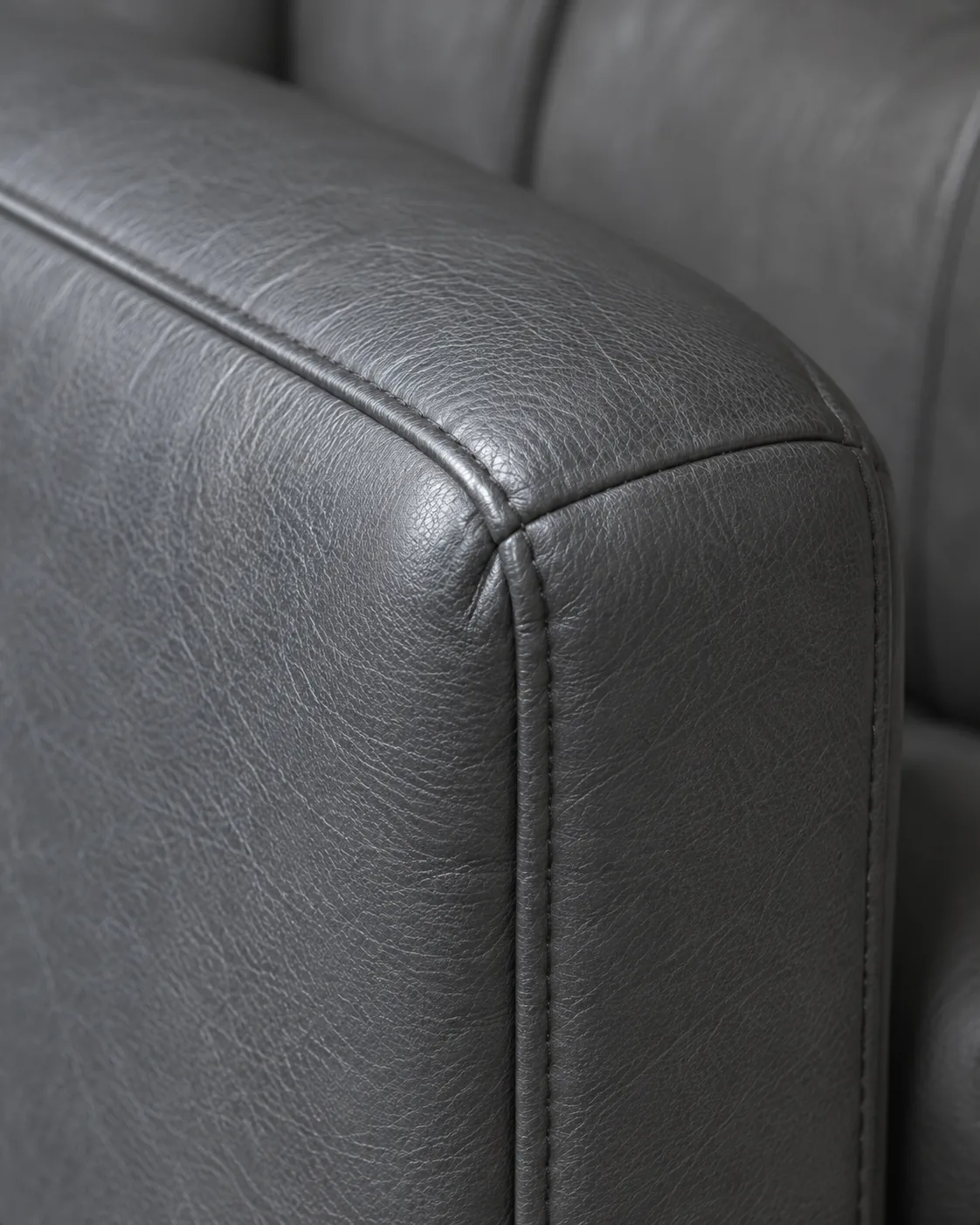 A grey commercial vinyl seating arm