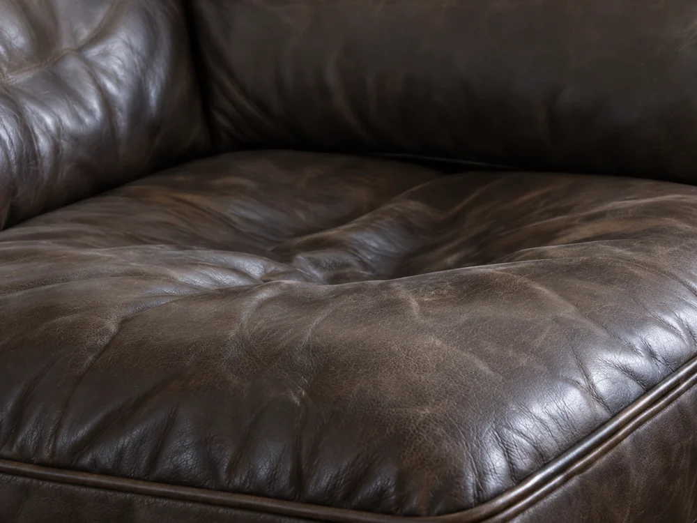 Sagging leather seat cushion dipping in the middle of a sofa