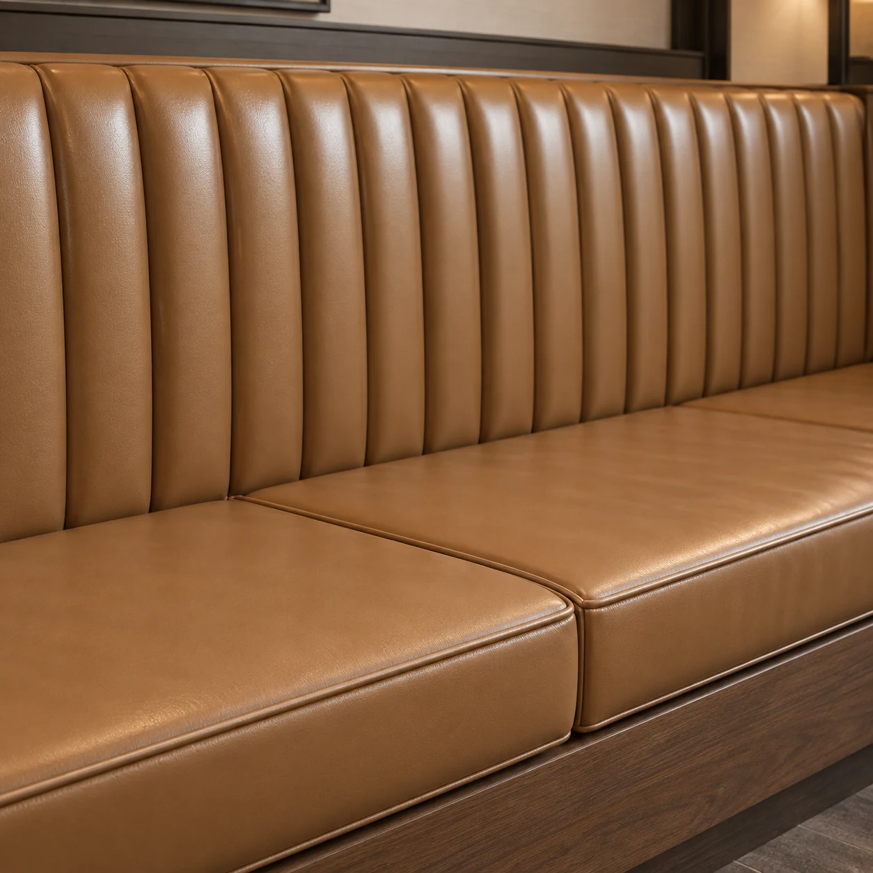 Channel-tufted leather banquette seat pads in a restaurant