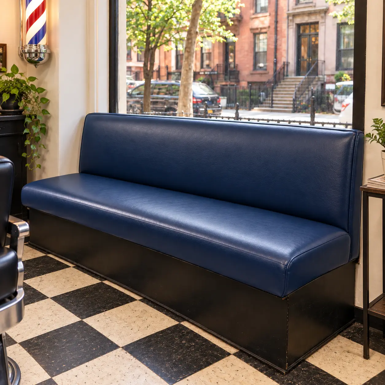 A recovered navy waiting bench in a barbershop