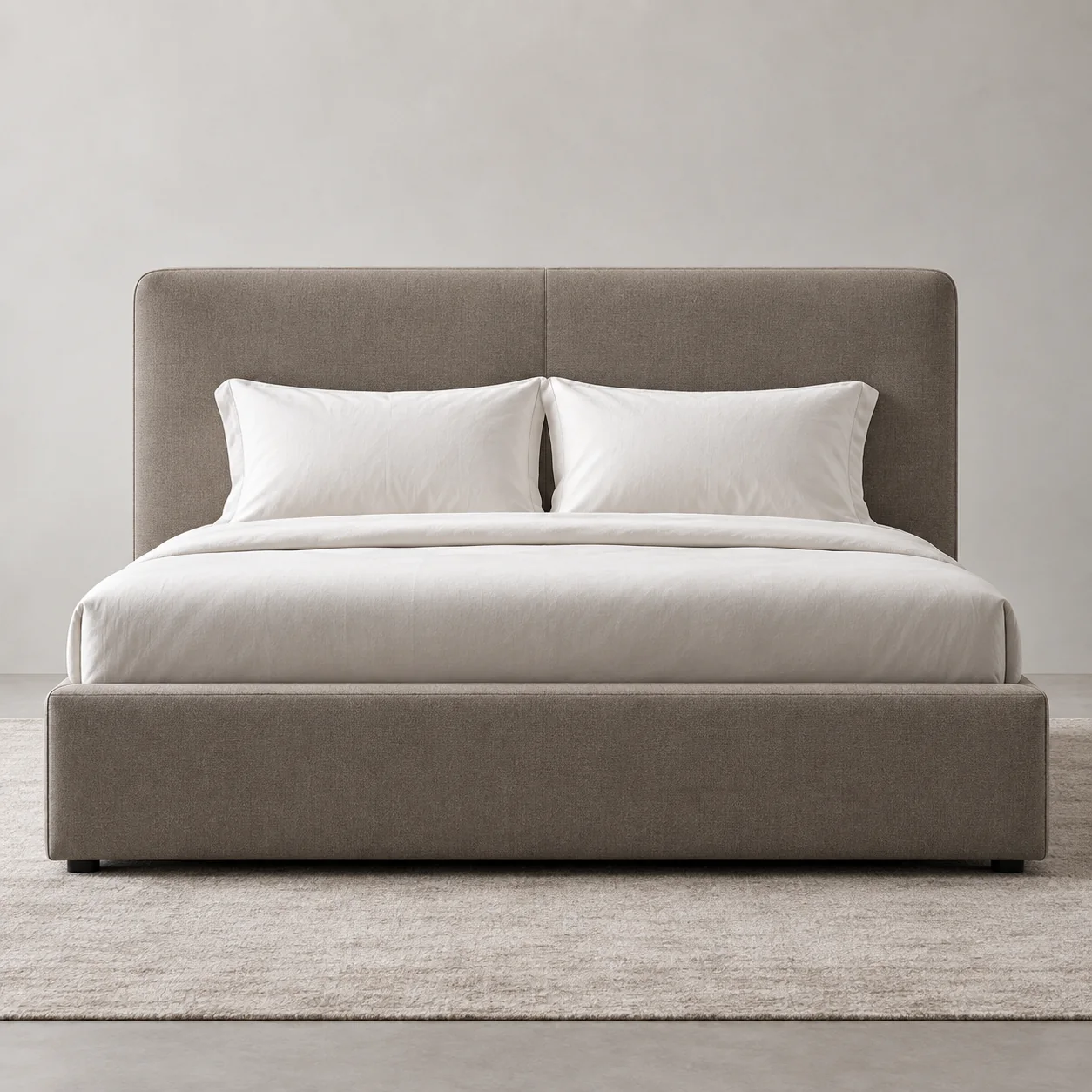 Upholstered platform bed with a low panelled headboard