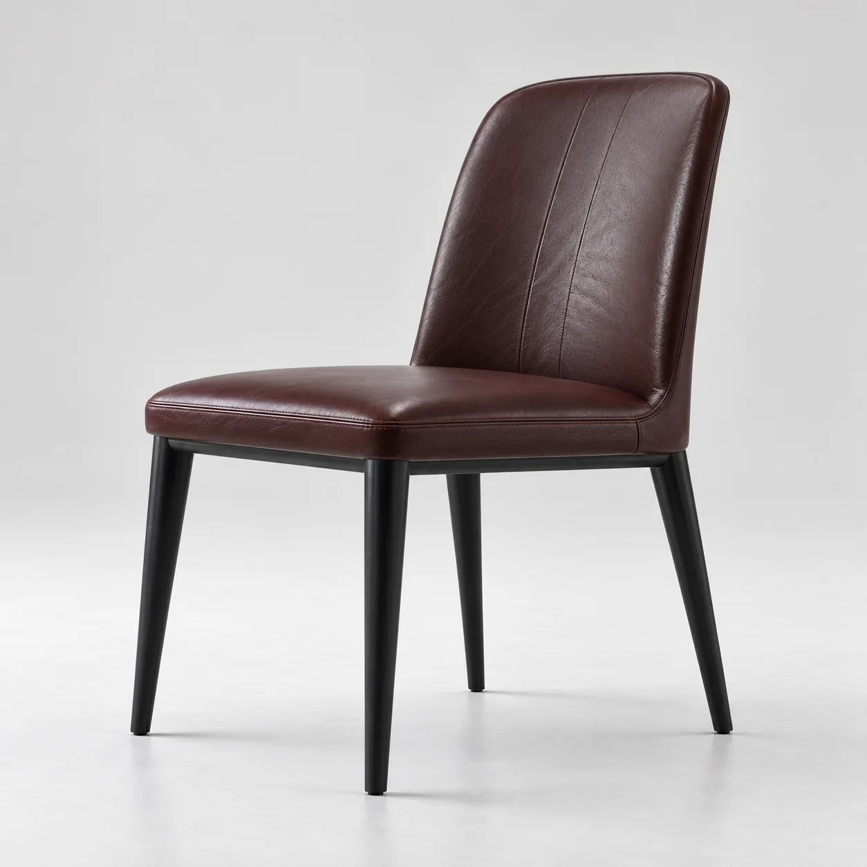 Burgundy leather dining chair with black tapered legs