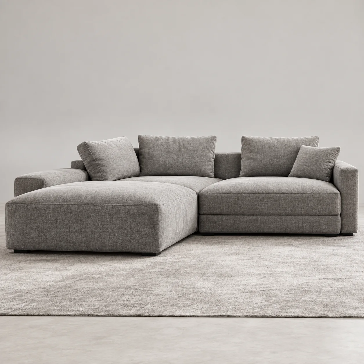 Grey chaise sectional with loose back cushions