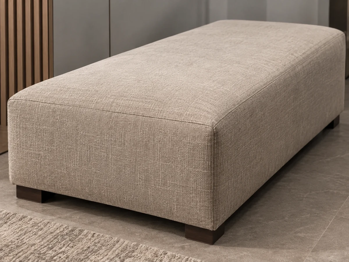 Long taupe bench seat cushion on dark wood feet