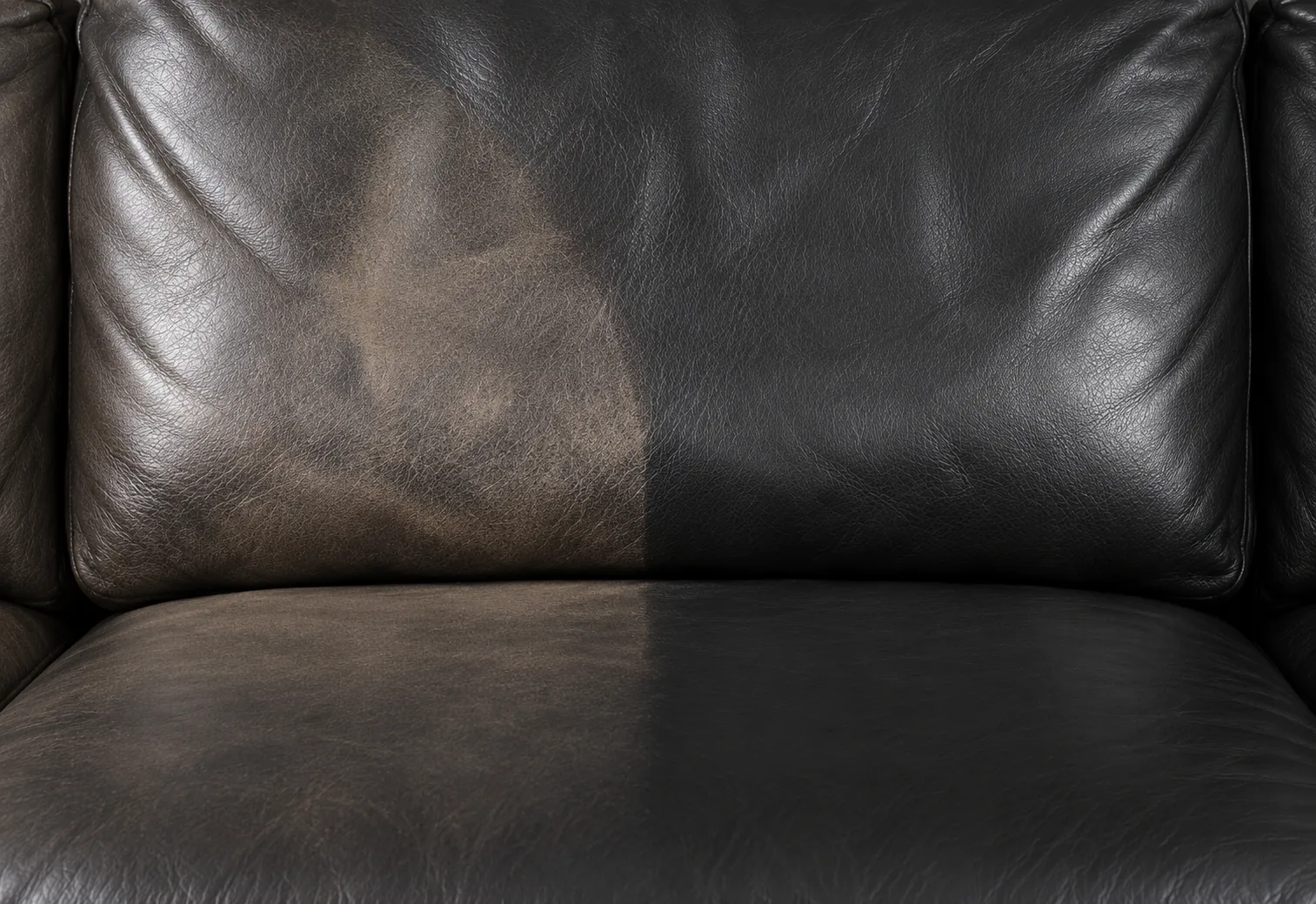 Black leather cushion, faded half and recolored half