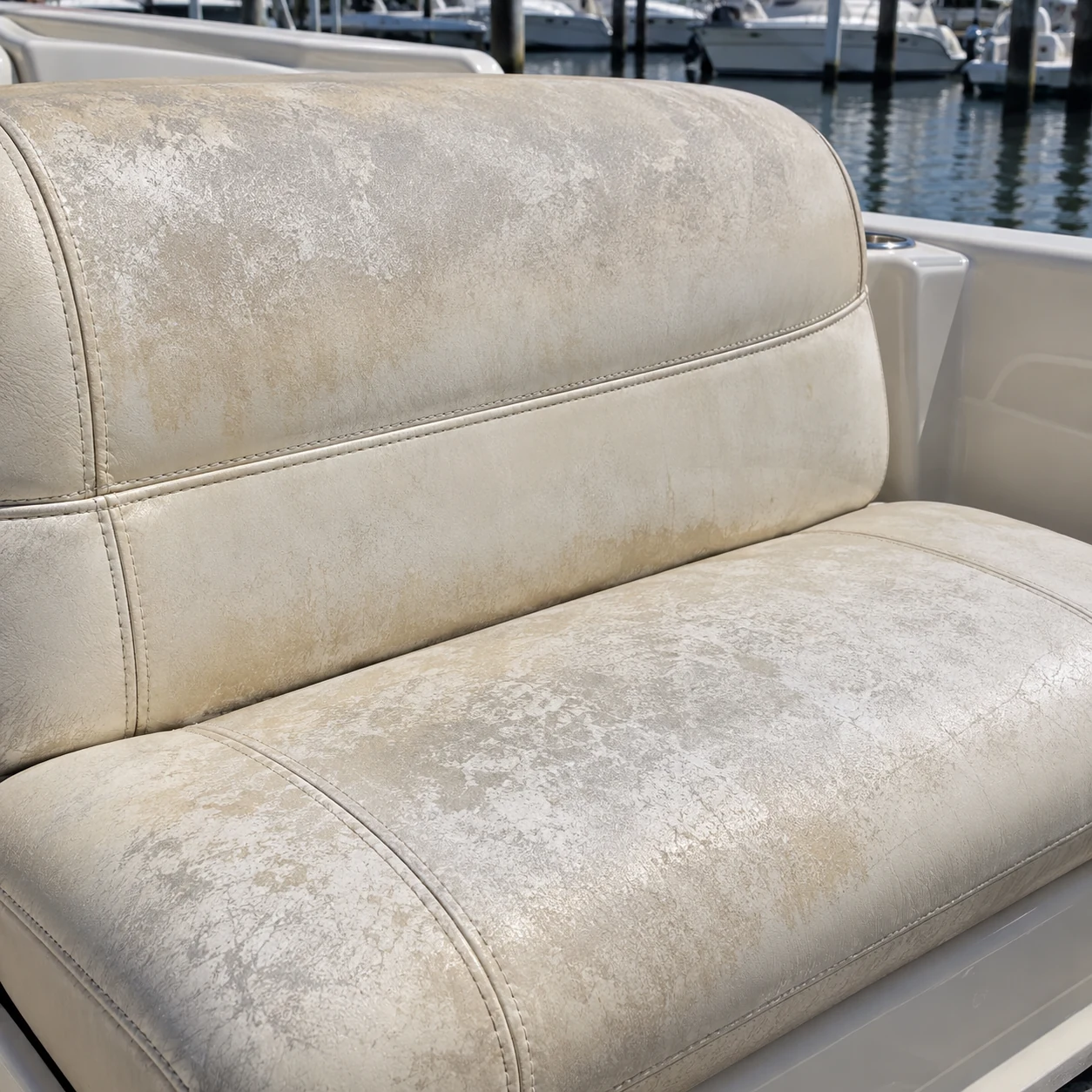Chalked and faded vinyl on a boat cushion