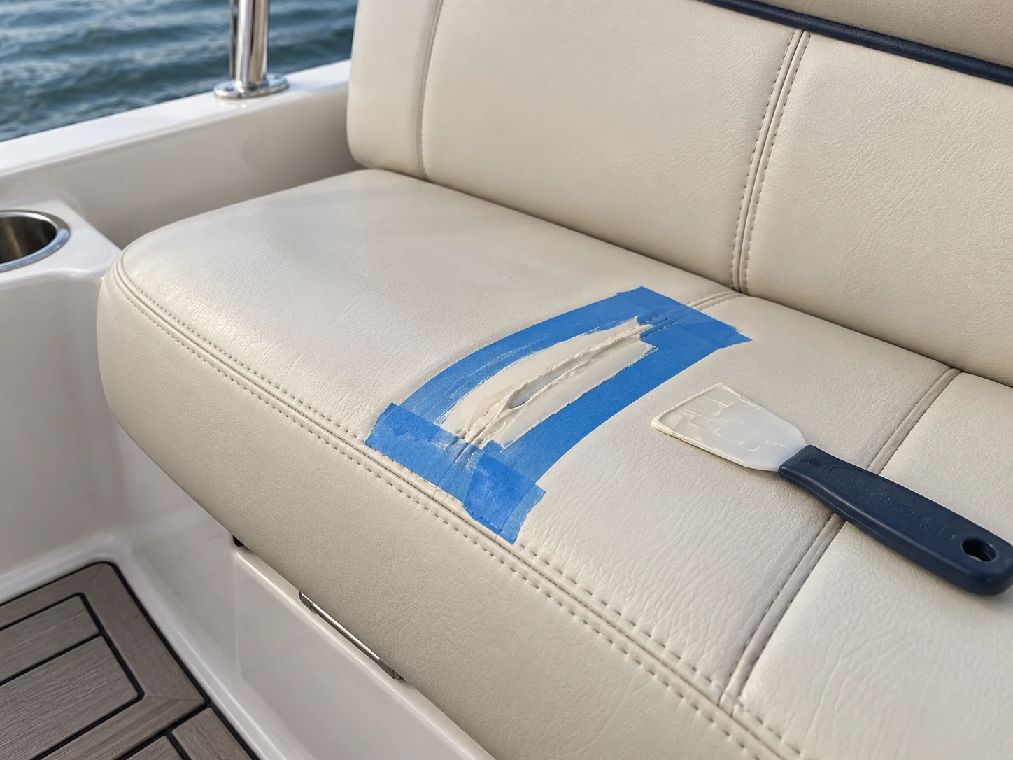 A small spot repair being finished on a boat seat