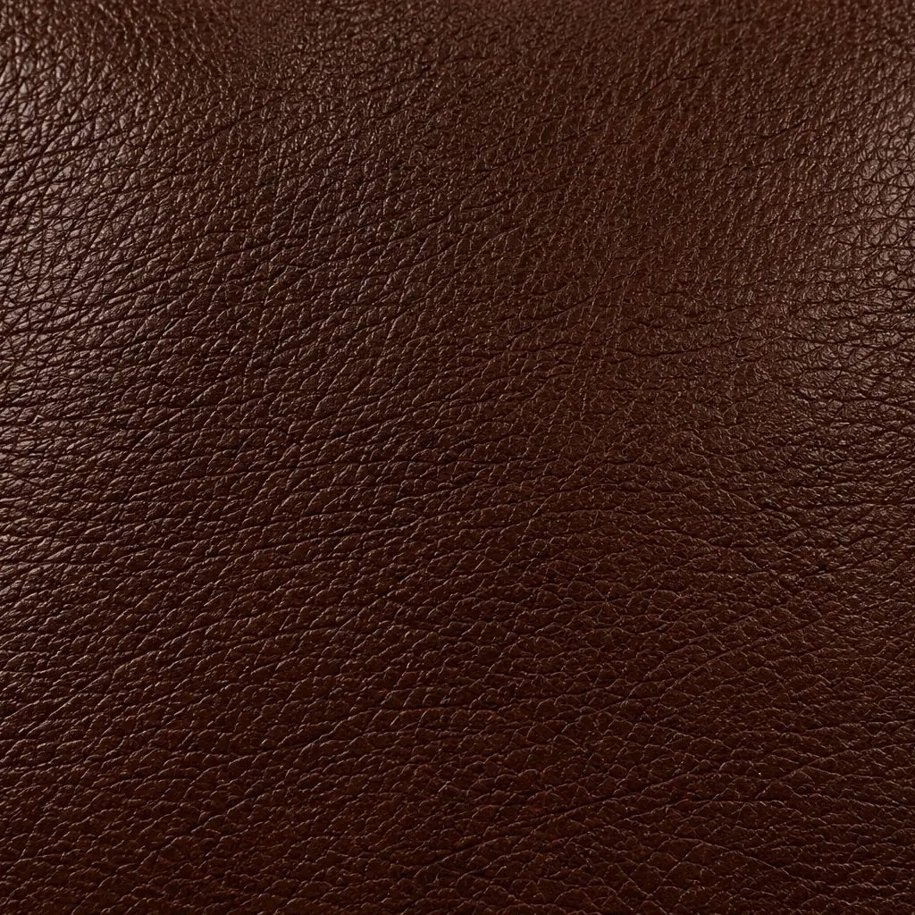 A flat swatch of chestnut brown leather for a bar stool seat top