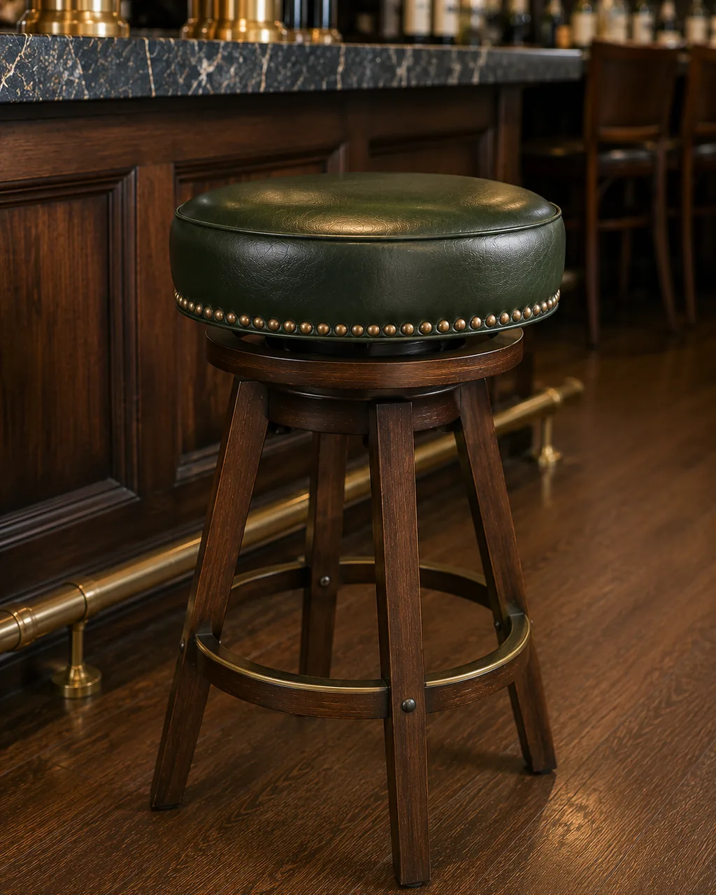 A round bar stool in green leather with the swivel plate visible beneath the pad