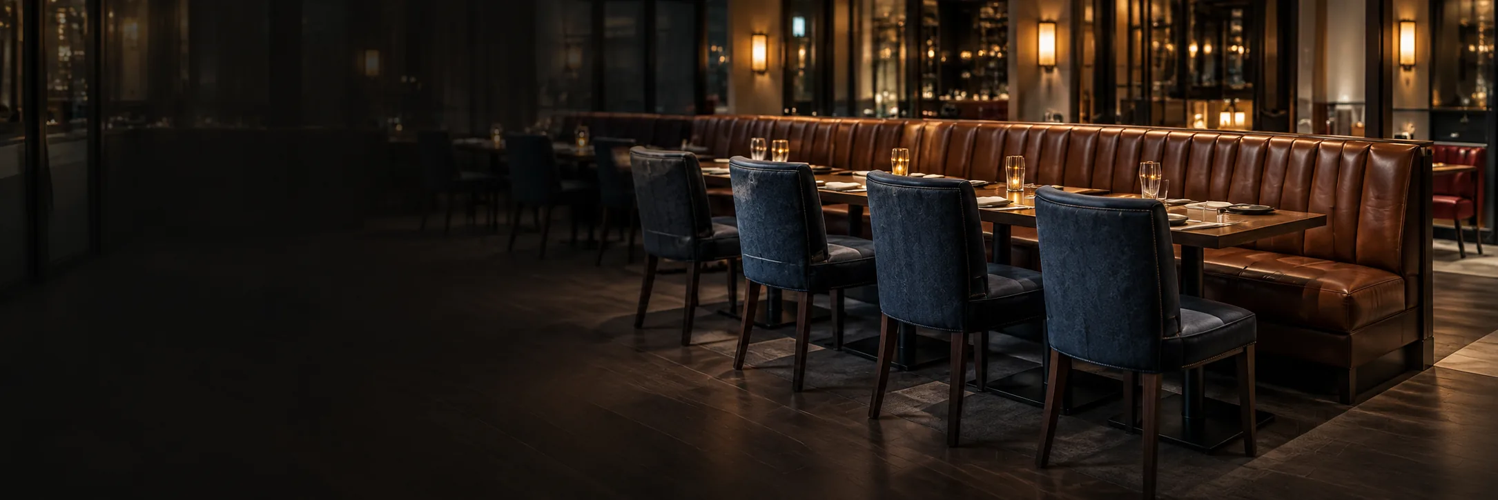 Restaurant banquette and dining chairs after a bulk leather furniture repair project