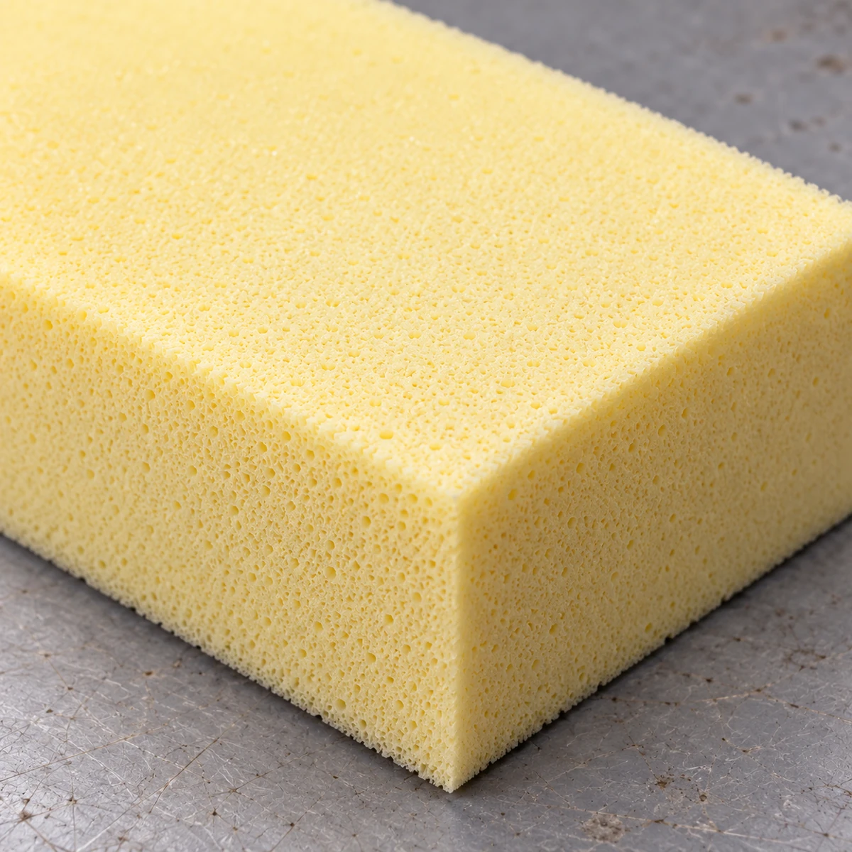 Close view of a cut block of bus seat foam