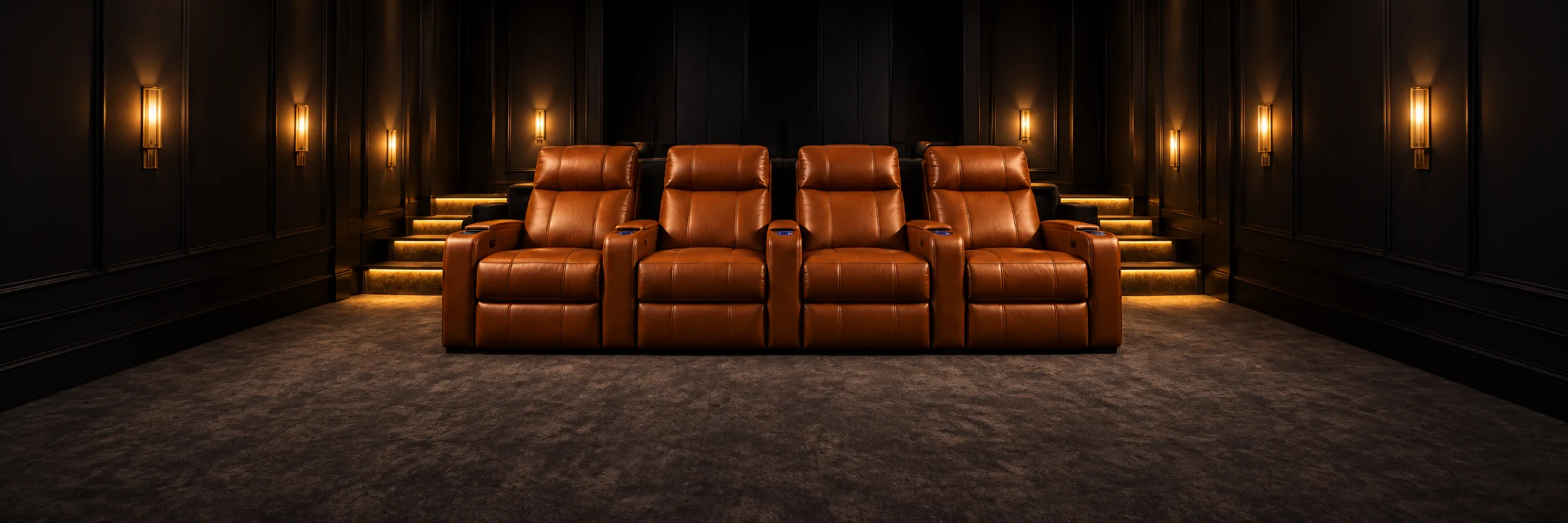Tiered cognac leather home theater seating in a dark private cinema, the setting for home theater seat repair