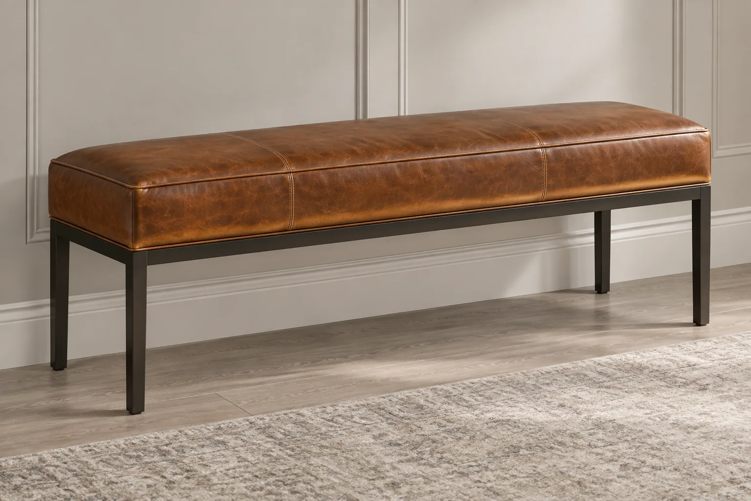 Long cognac backless bench on a dark metal frame
