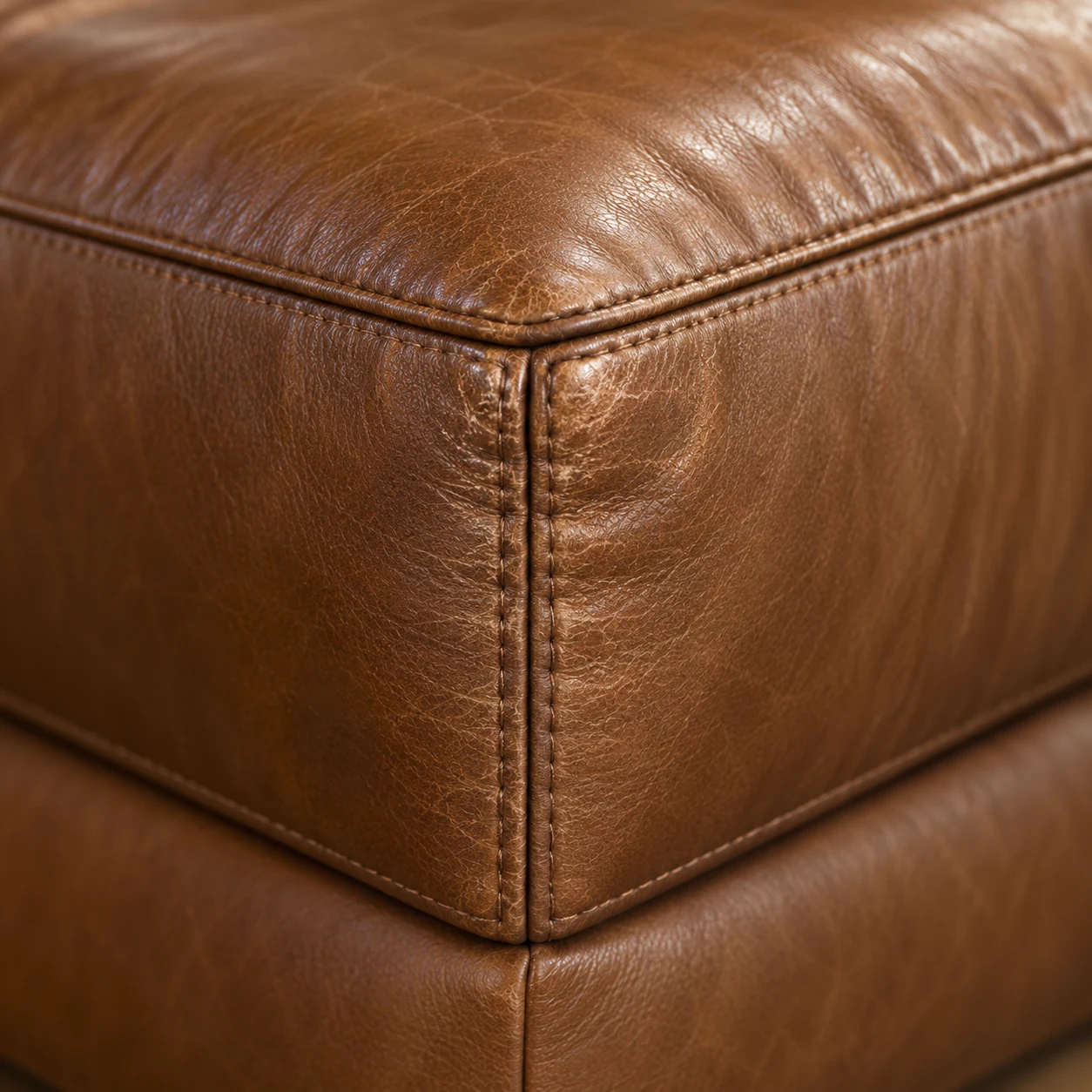 Boxed corner block on a cognac leather sectional