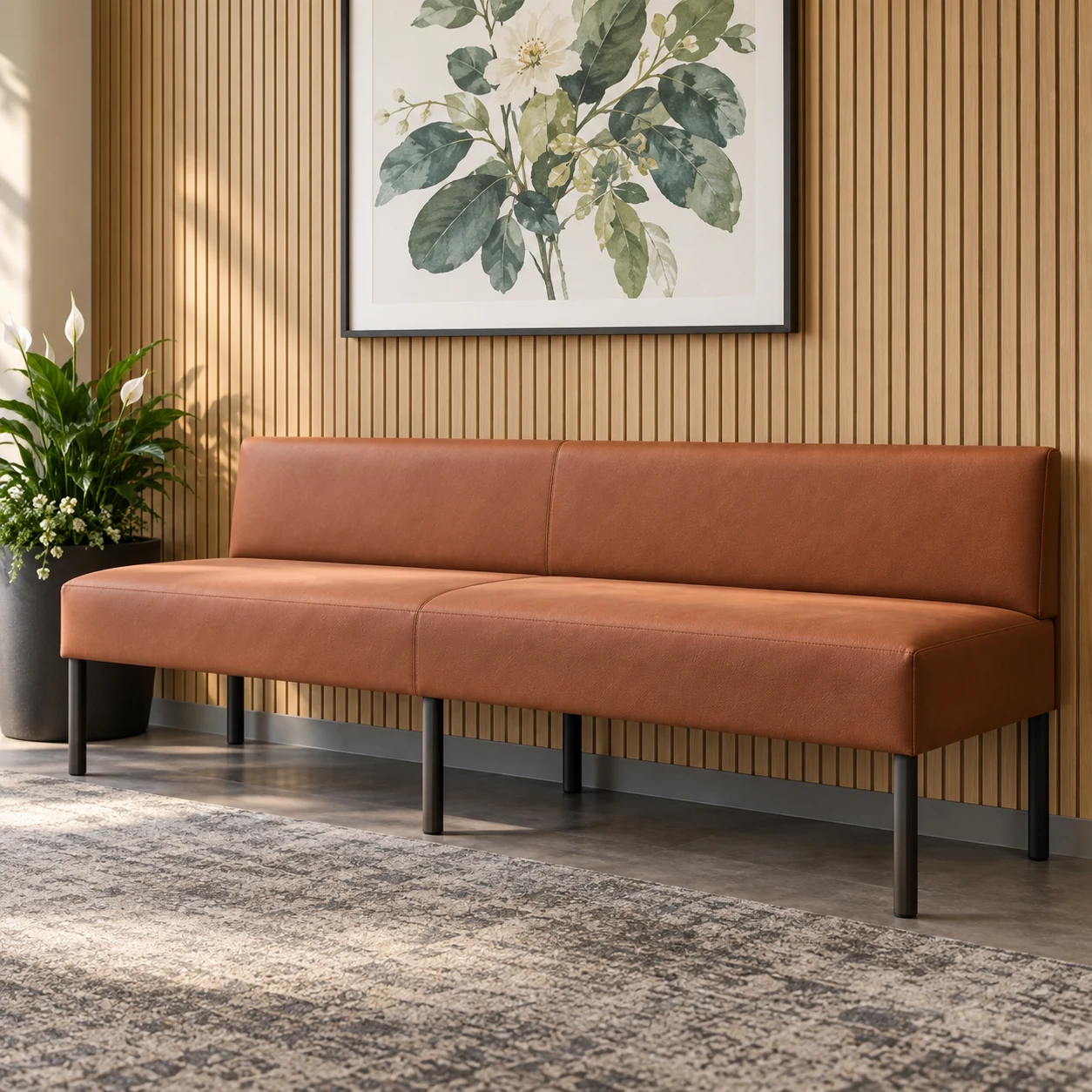 Cognac leather waiting room bench against a wood wall