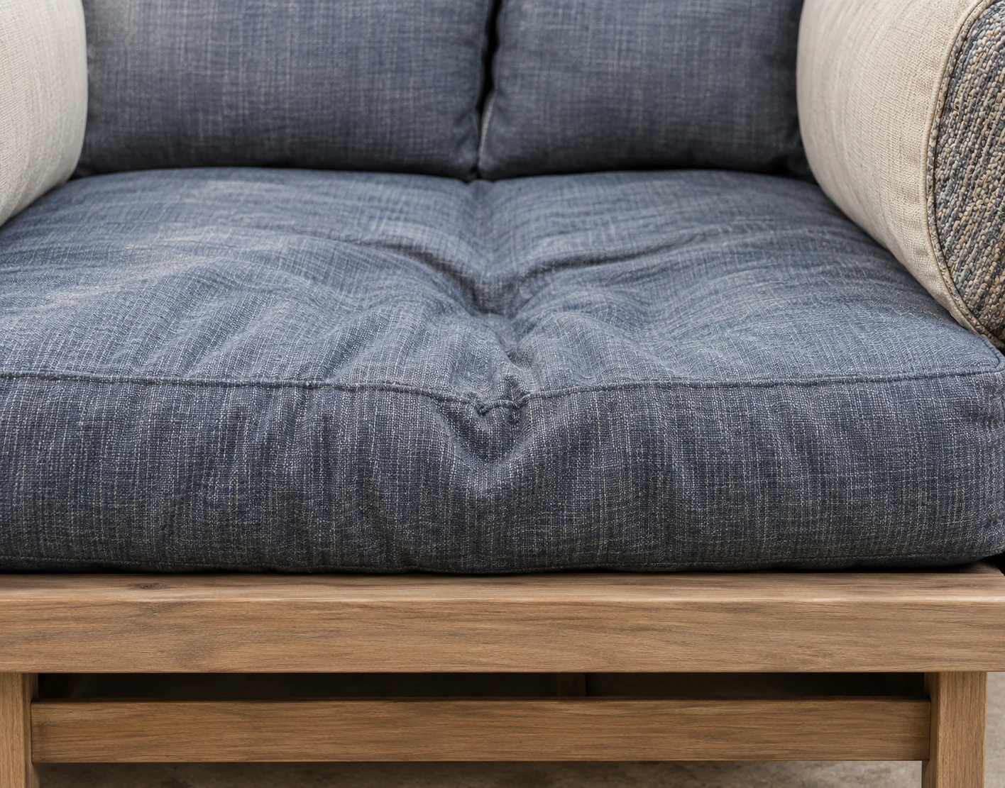 Compressed outdoor cushion holding a dent in the seat after use