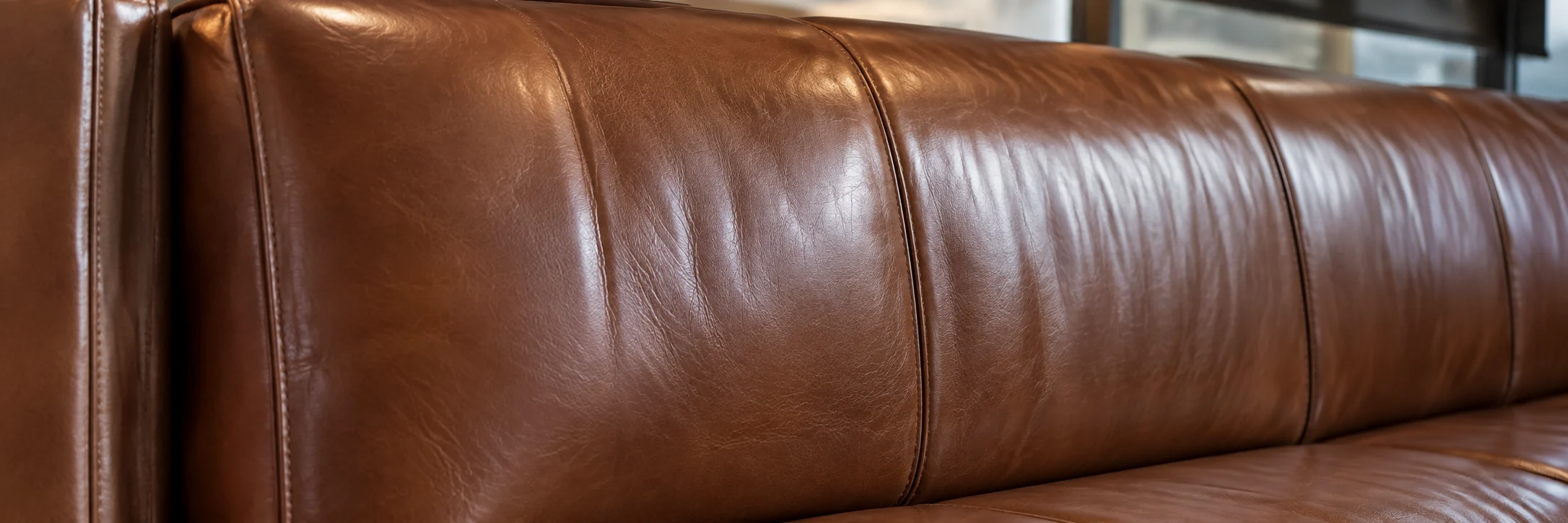 Evenly finished brown leather seating after contract repair work