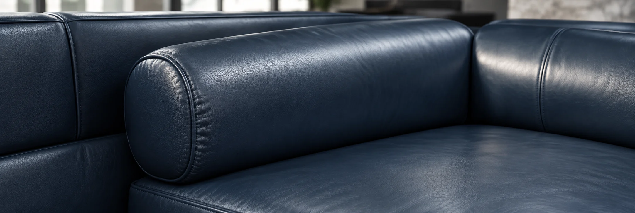 Deep navy leather sofa after commercial colour restoration