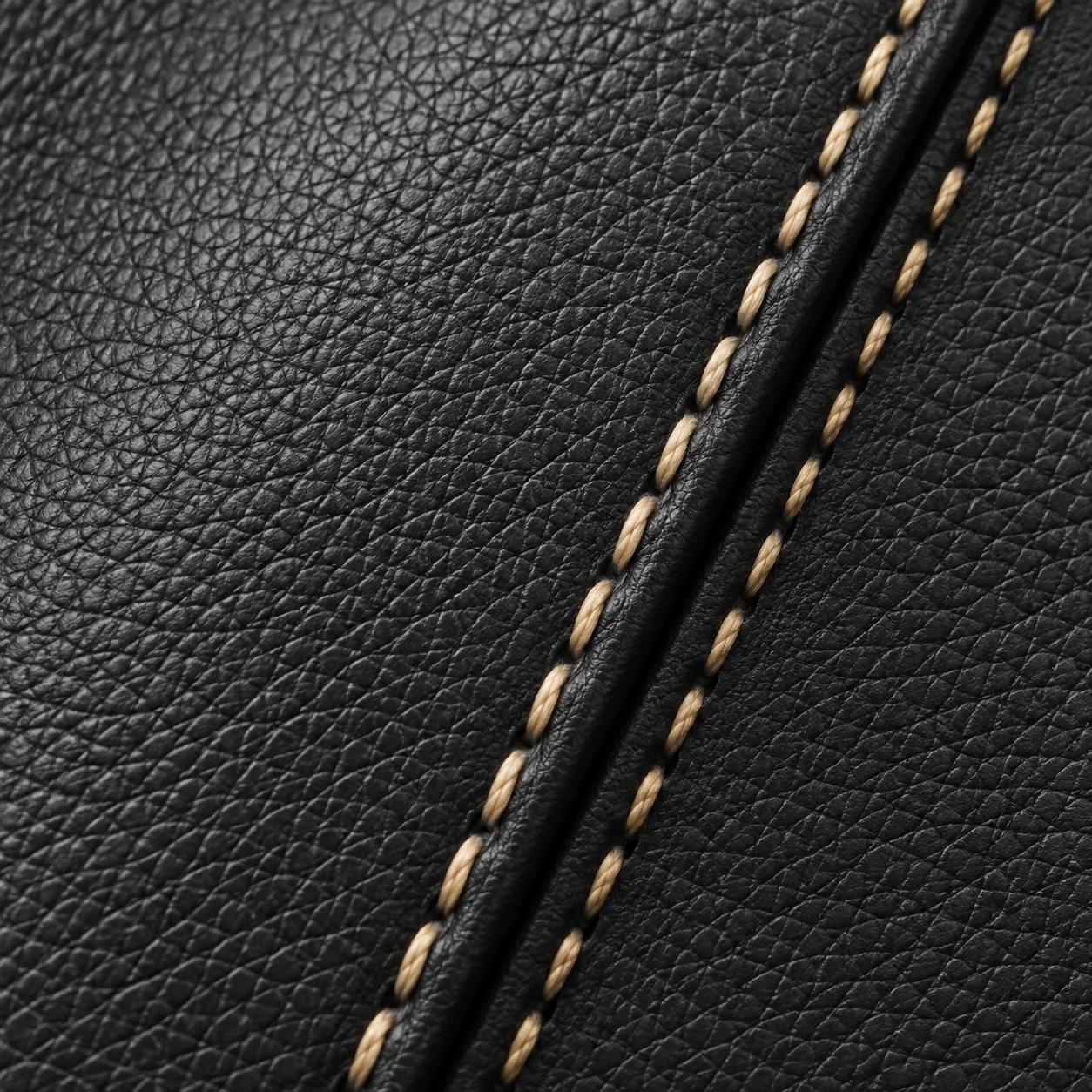 Contrast stitch line along black leather