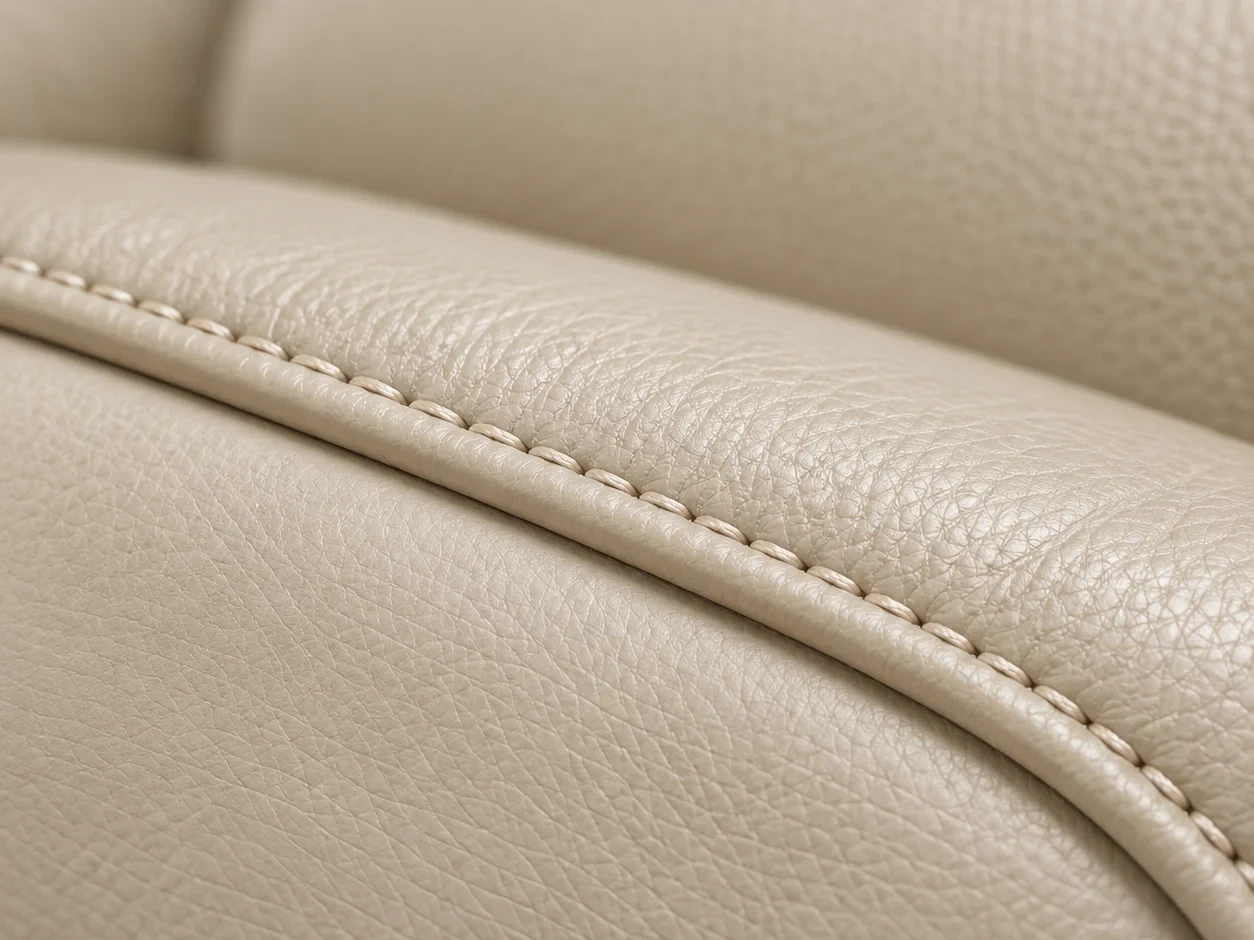 Close view of the stitching running along a couch cushion seam