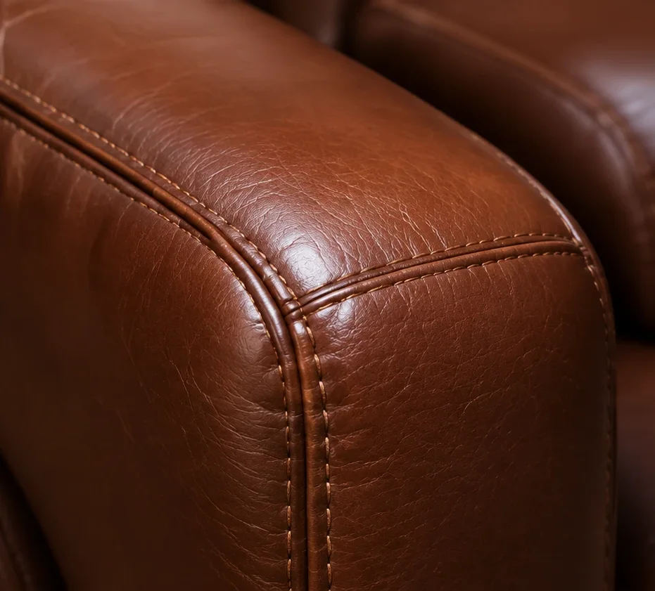 The same sofa arm after treatment with the grain even and the cracking closed