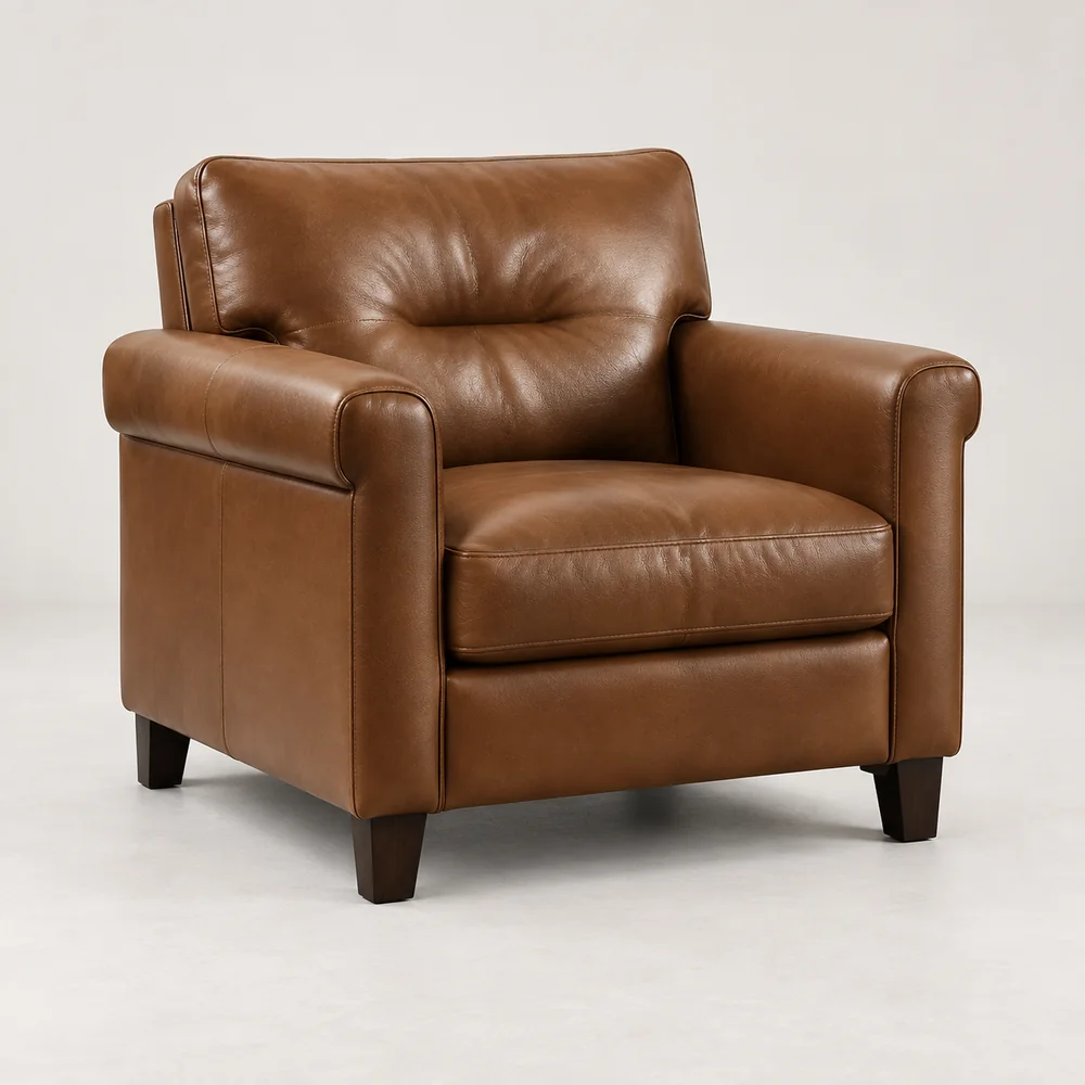 A cognac leather lounge chair with a rolled arm