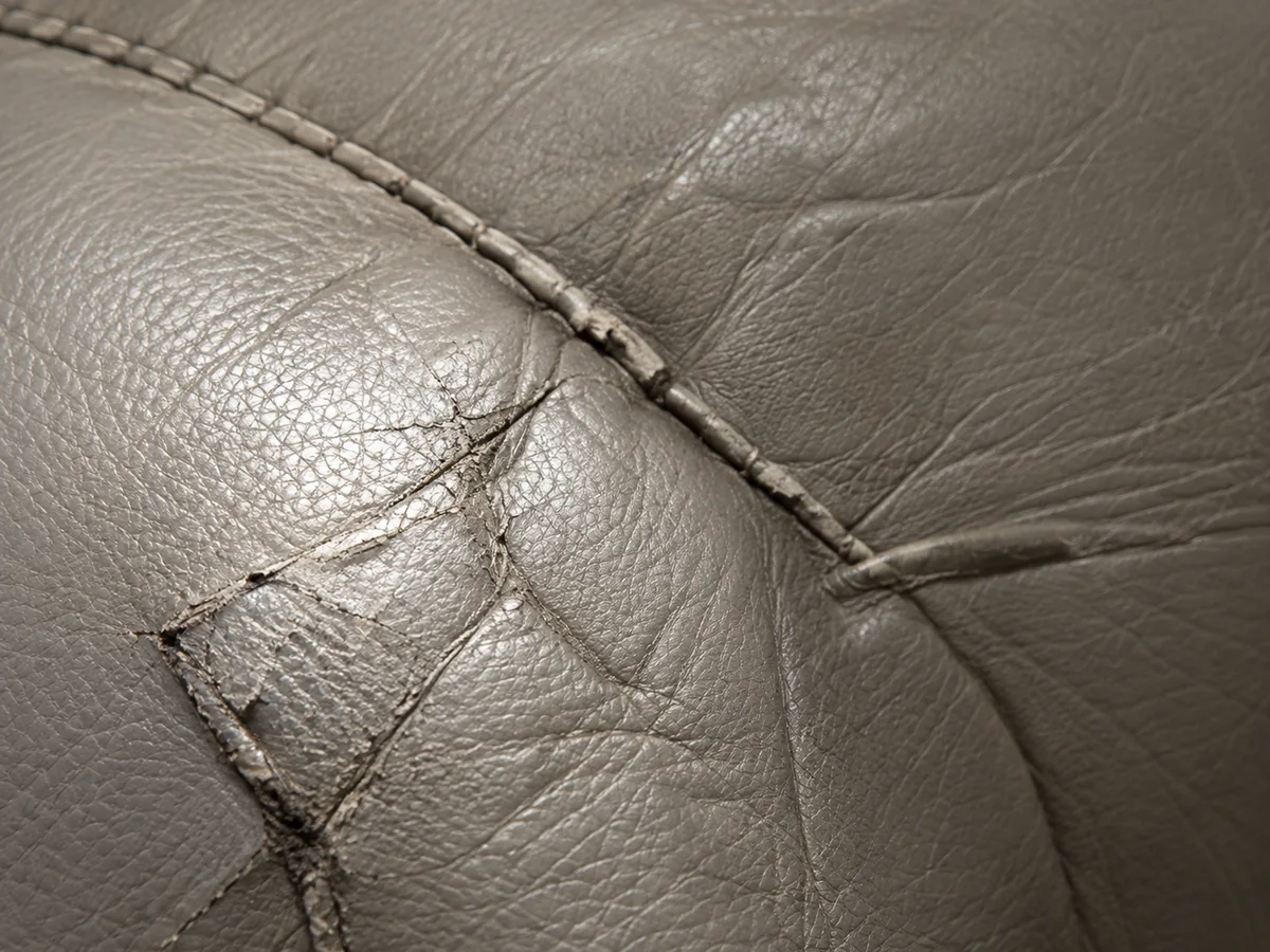 General wear splitting the leather along a seat corner