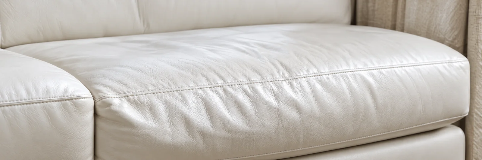 A leather seat cushion gone soft and creased through the middle
