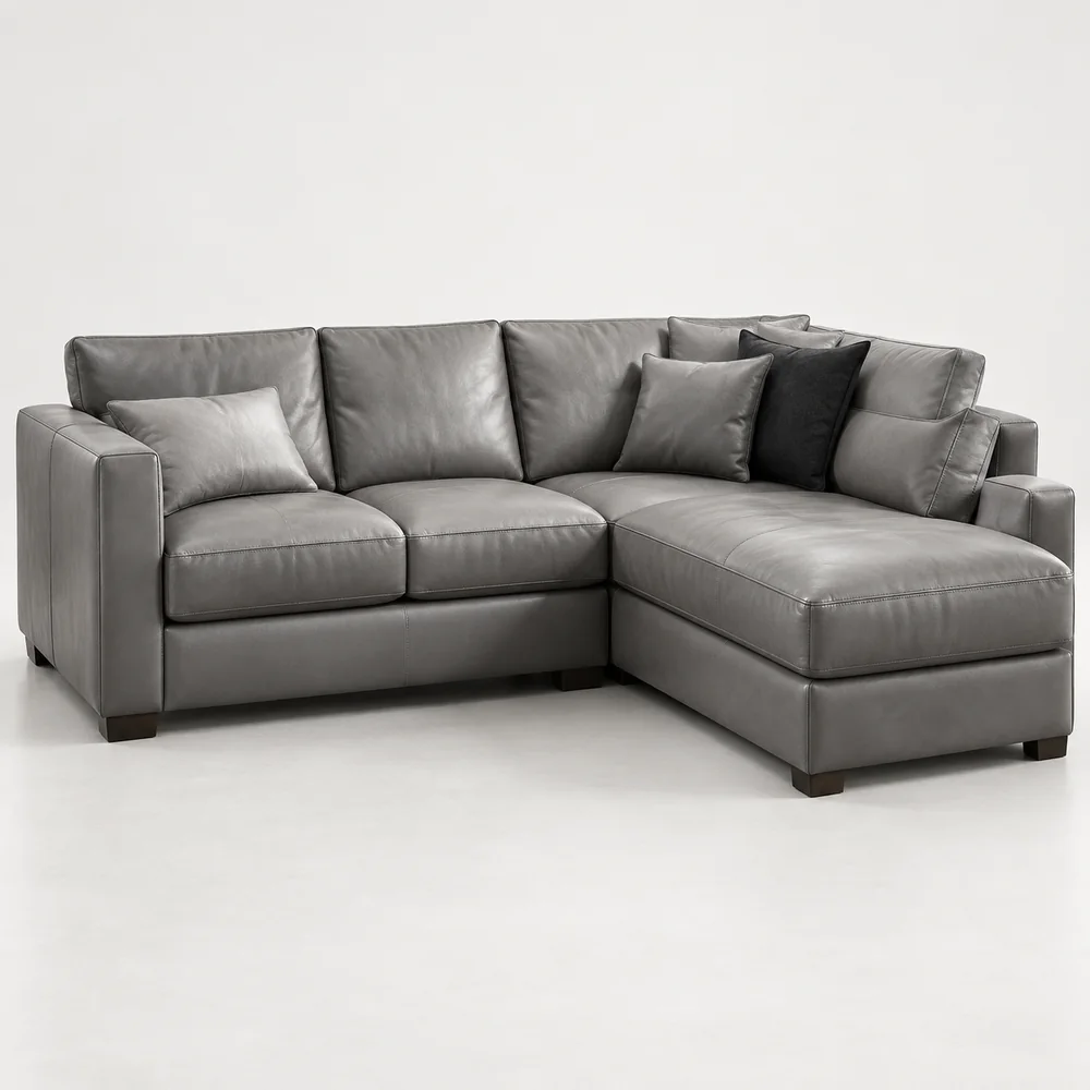 A grey leather sectional with a deep chaise