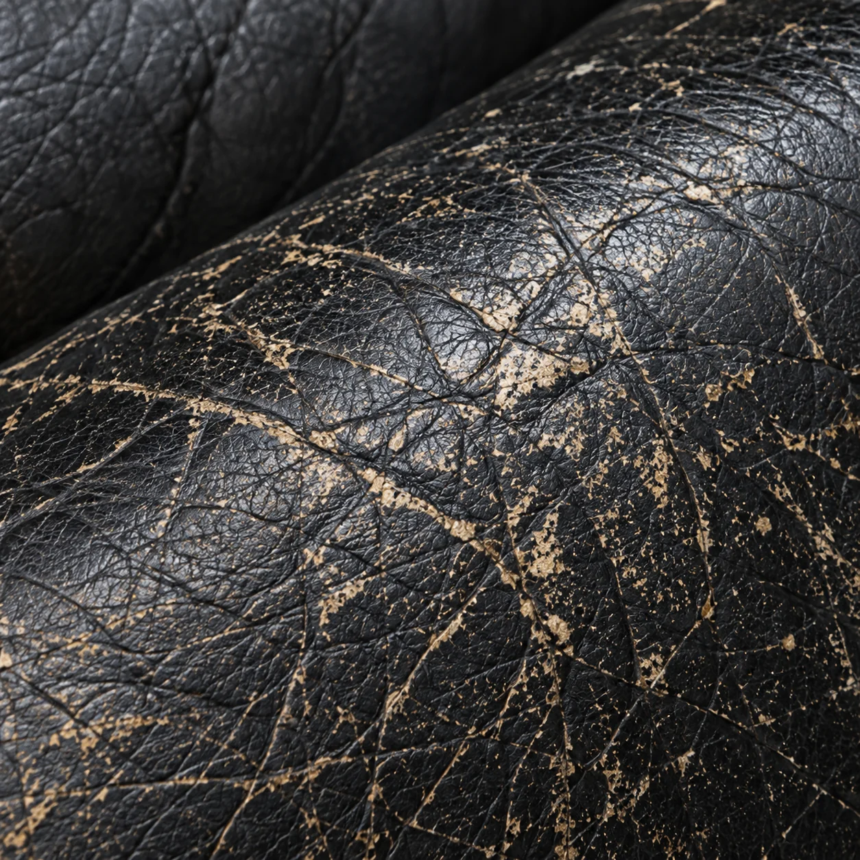 Black leather crazed all over with a fine network of tan cracks