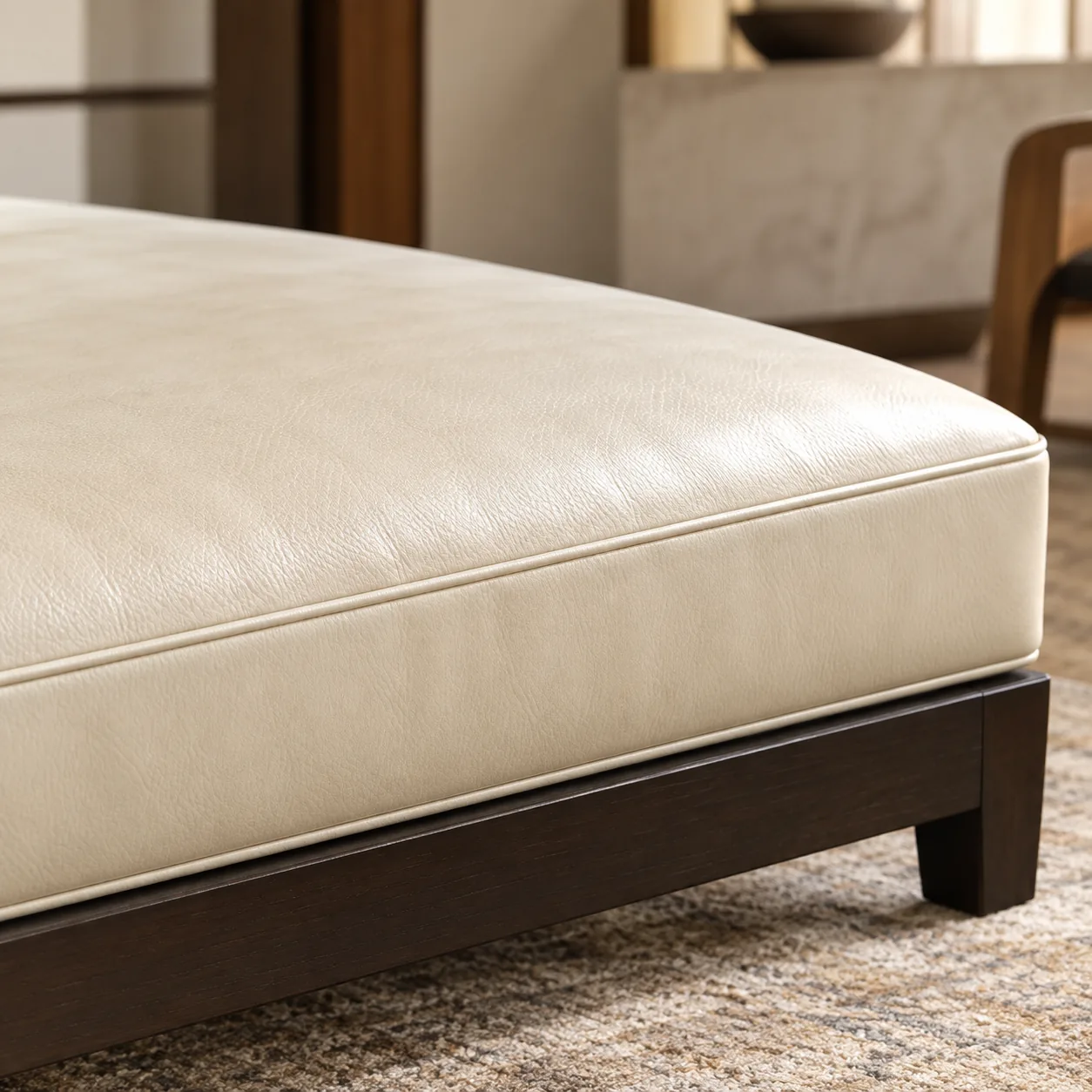 Cream bench cleaned back to an even tone on dark wood legs