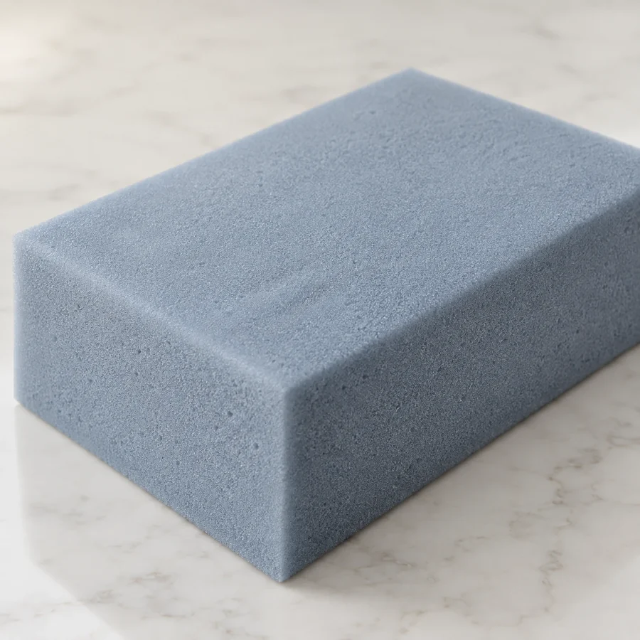 Block of blue-grey memory foam used as a comfort layer