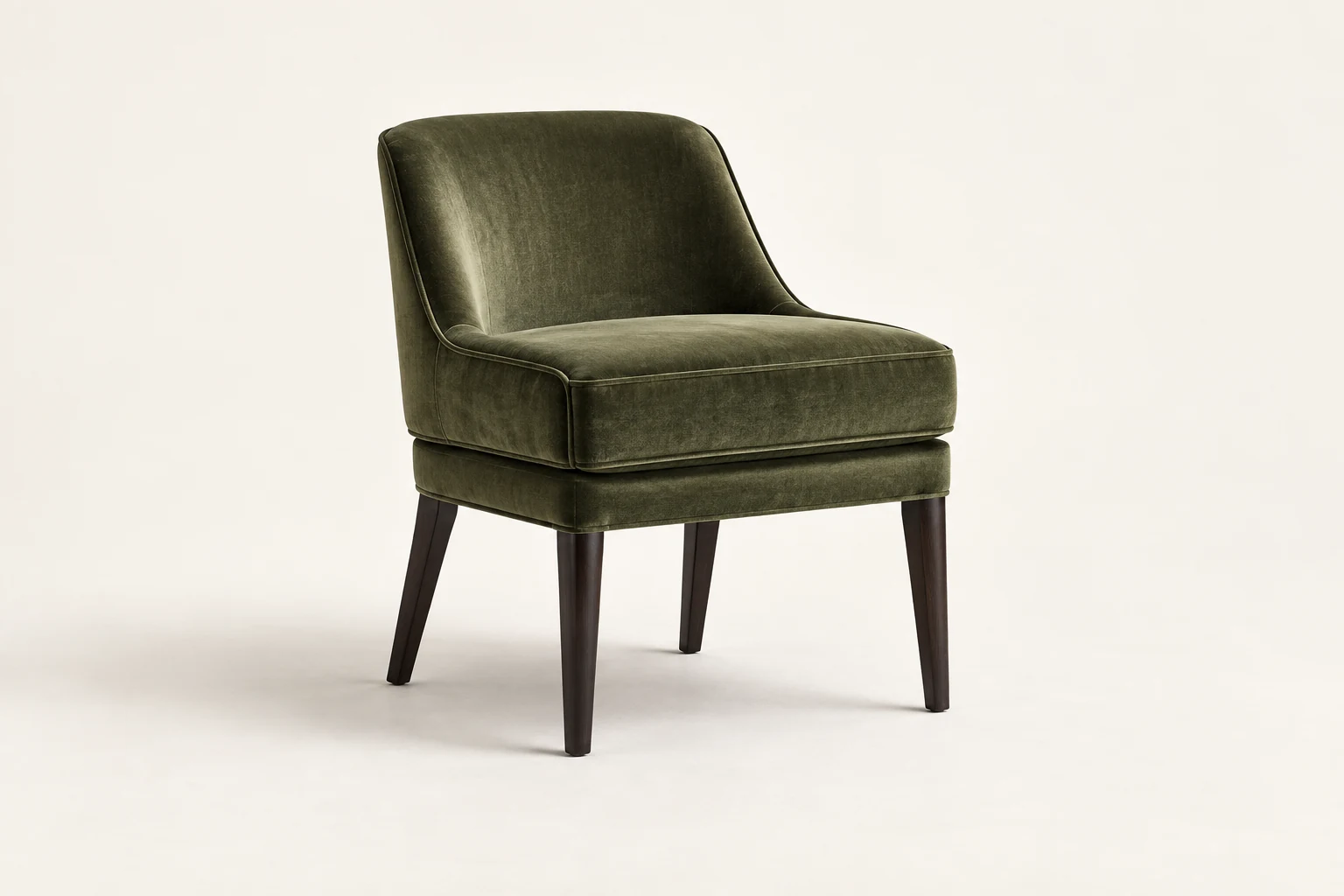 Dining chair upholstered in green velvet on a dark wood frame
