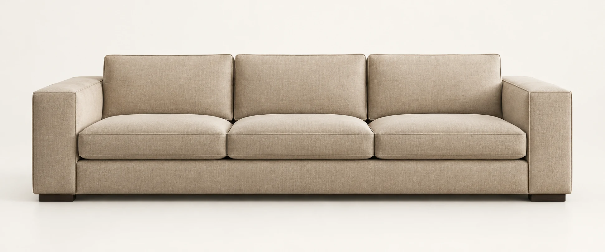 Custom three-seat sofa in natural linen with a plinth base