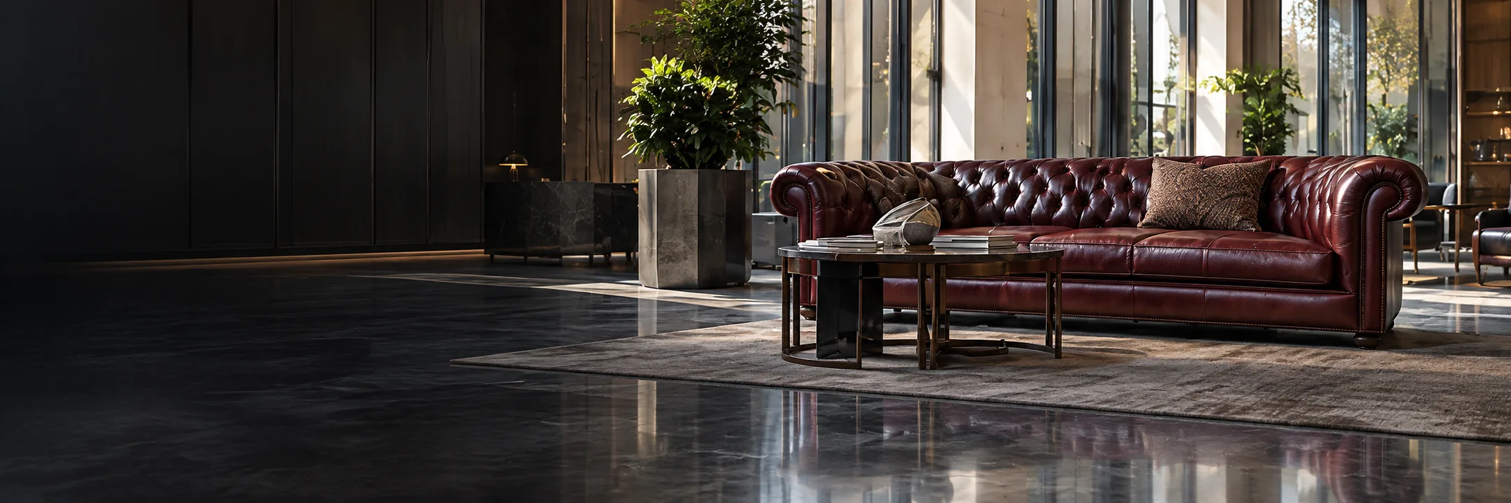 Chesterfield sofa in a dark hotel lobby at dusk