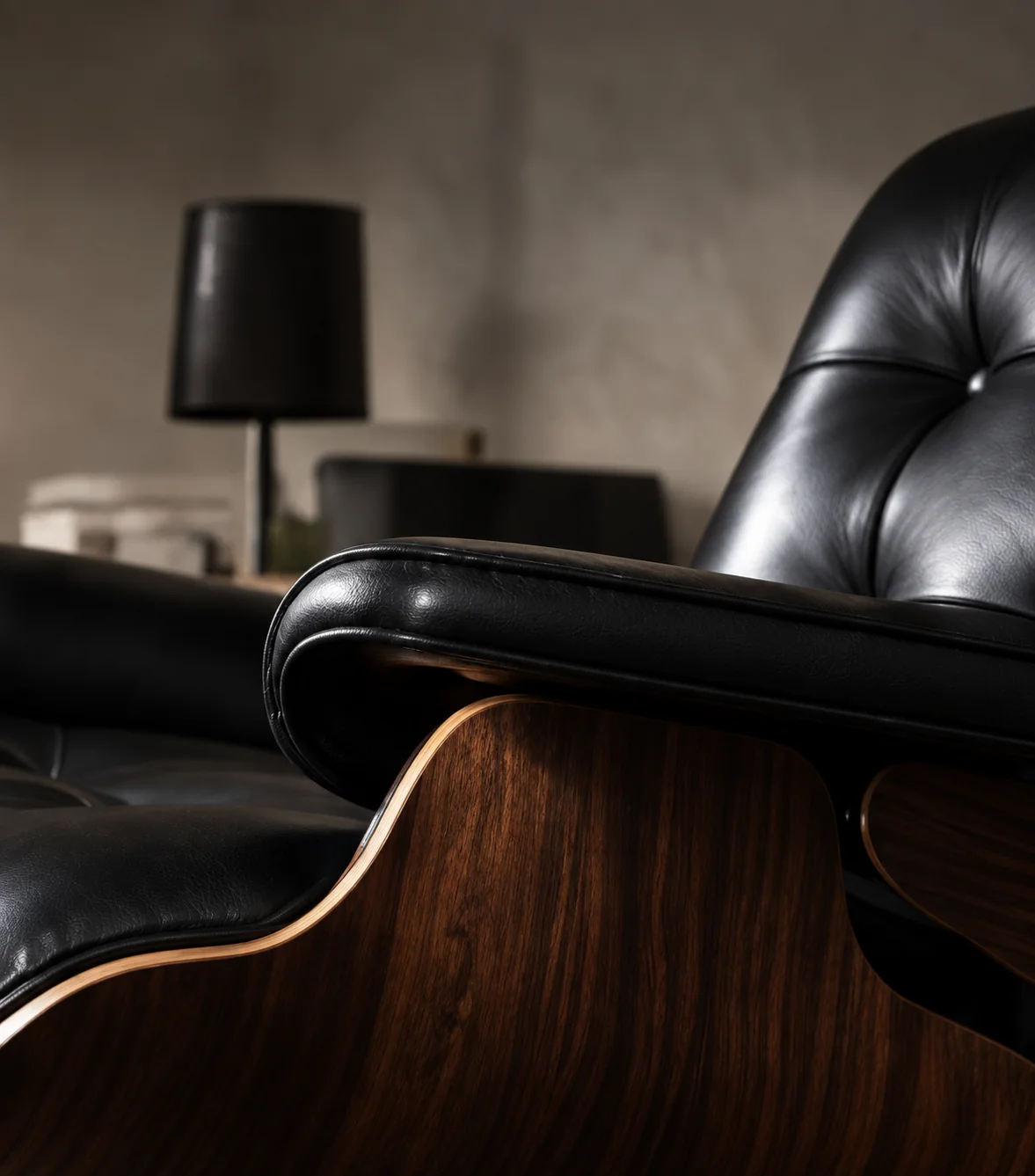 Black leather lounge chair on a walnut shell