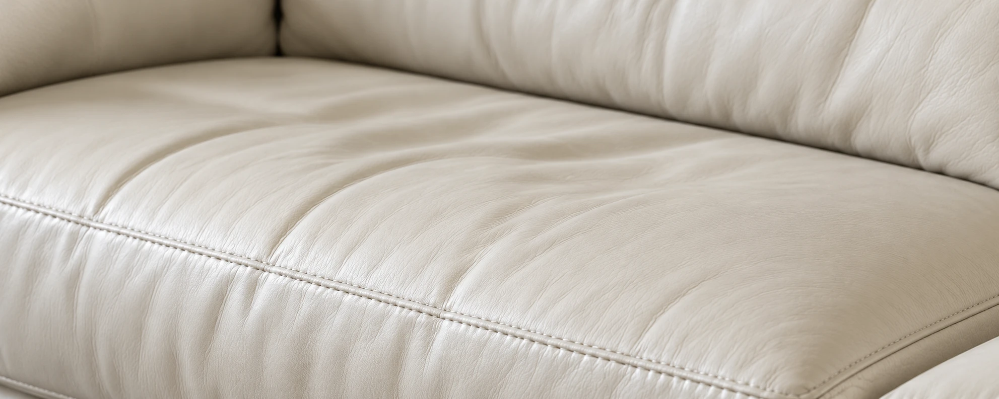 Cream leather seat cushions that have lost their shape