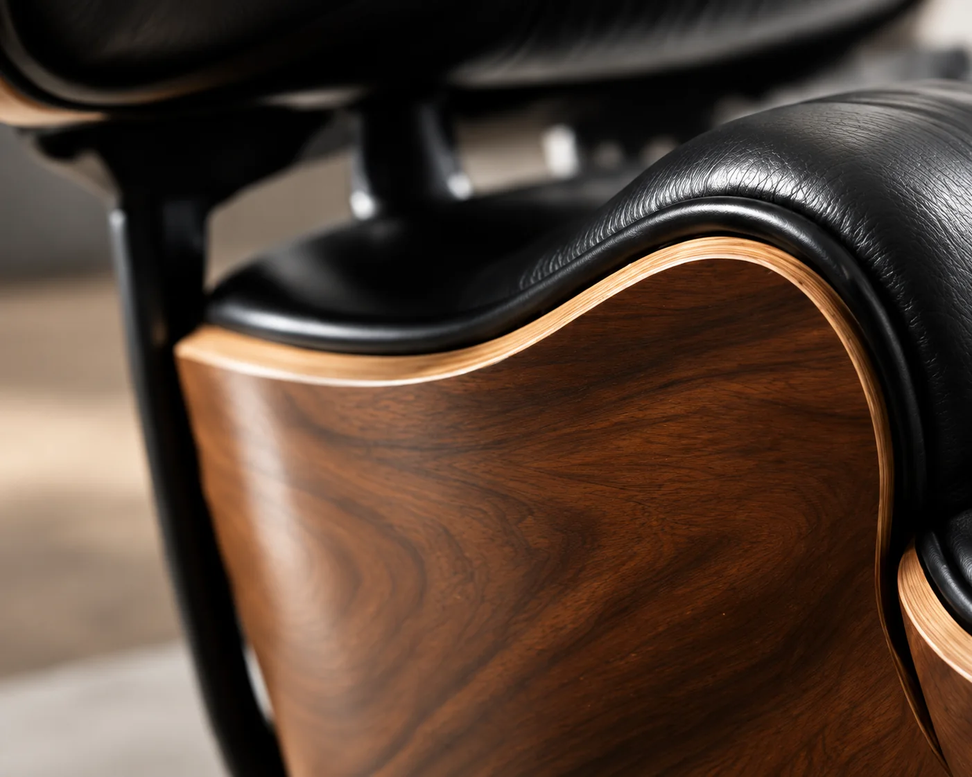 Walnut shell and black leather on an Eames lounge chair
