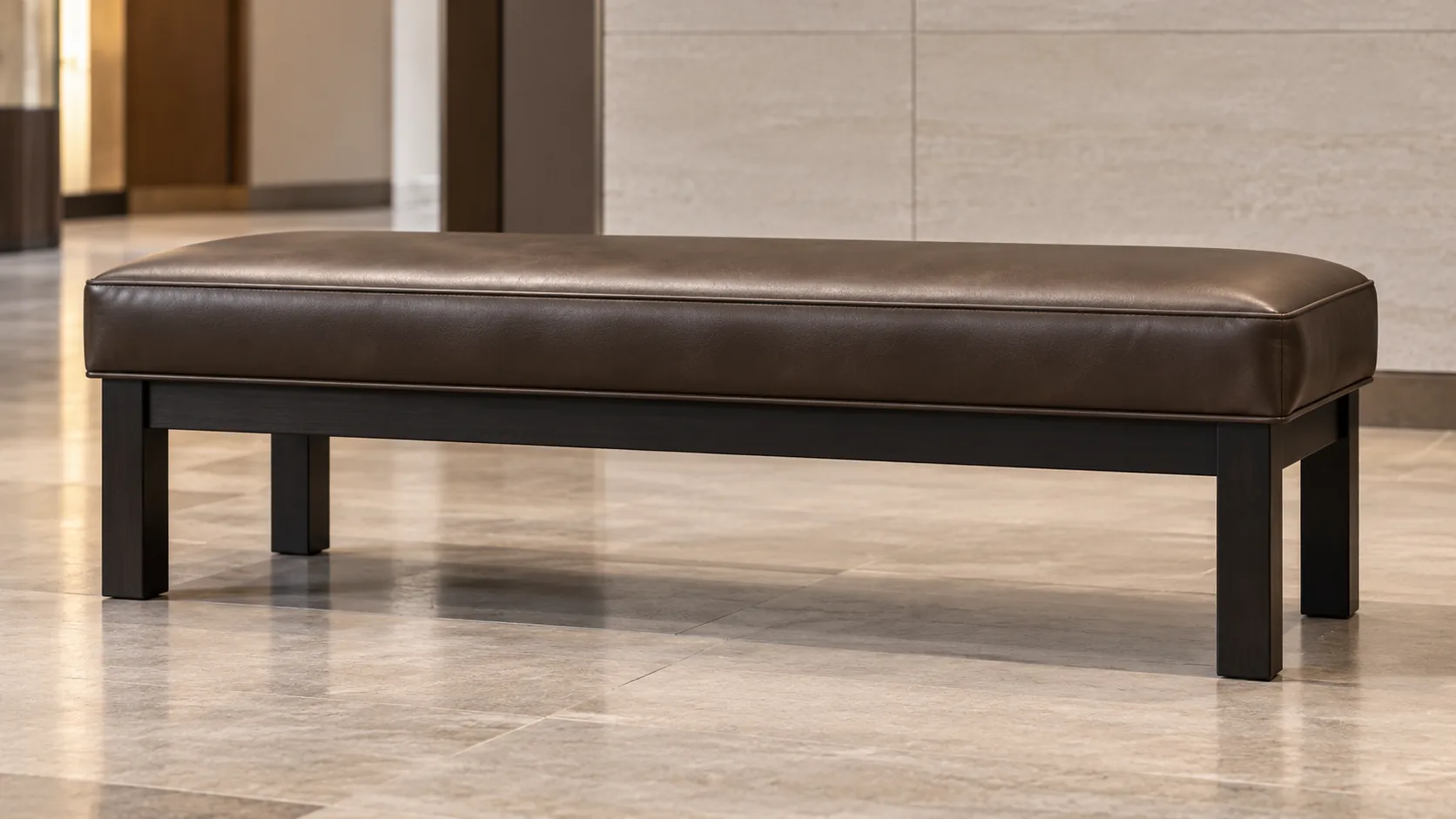Dark brown upholstered bench in a lobby