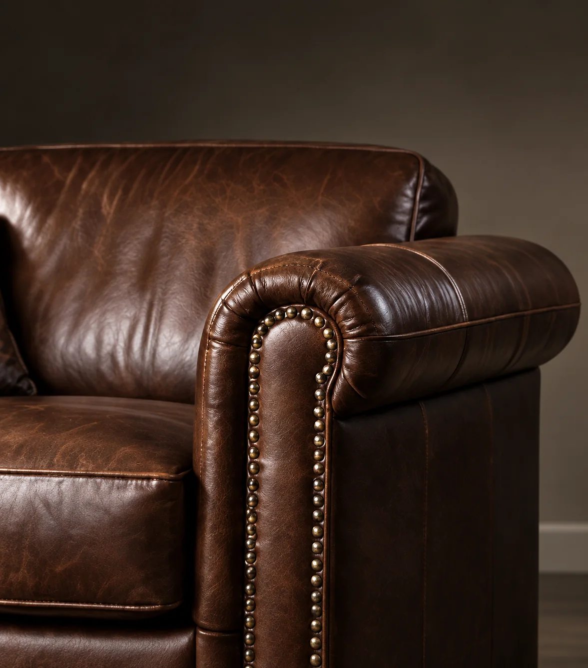 Brown leather rolled arm with nailhead trim