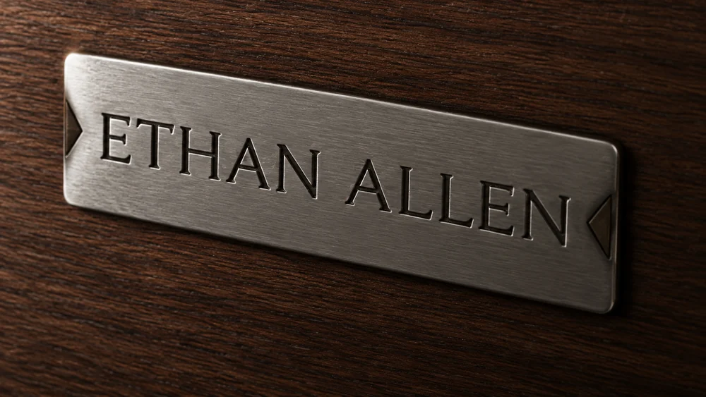 Ethan Allen metal plaque fixed to a leather frame