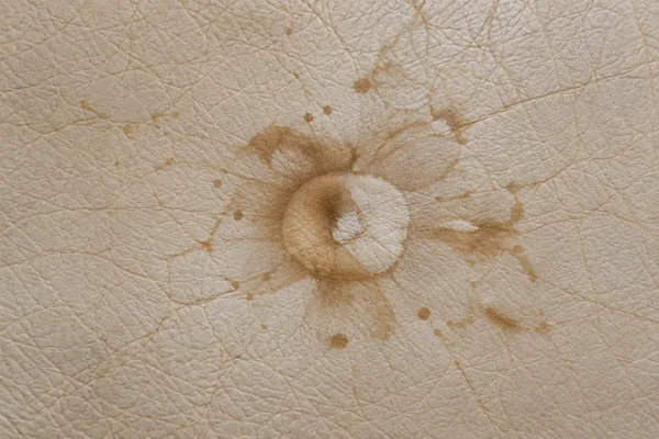 A dark stain soaked into leather