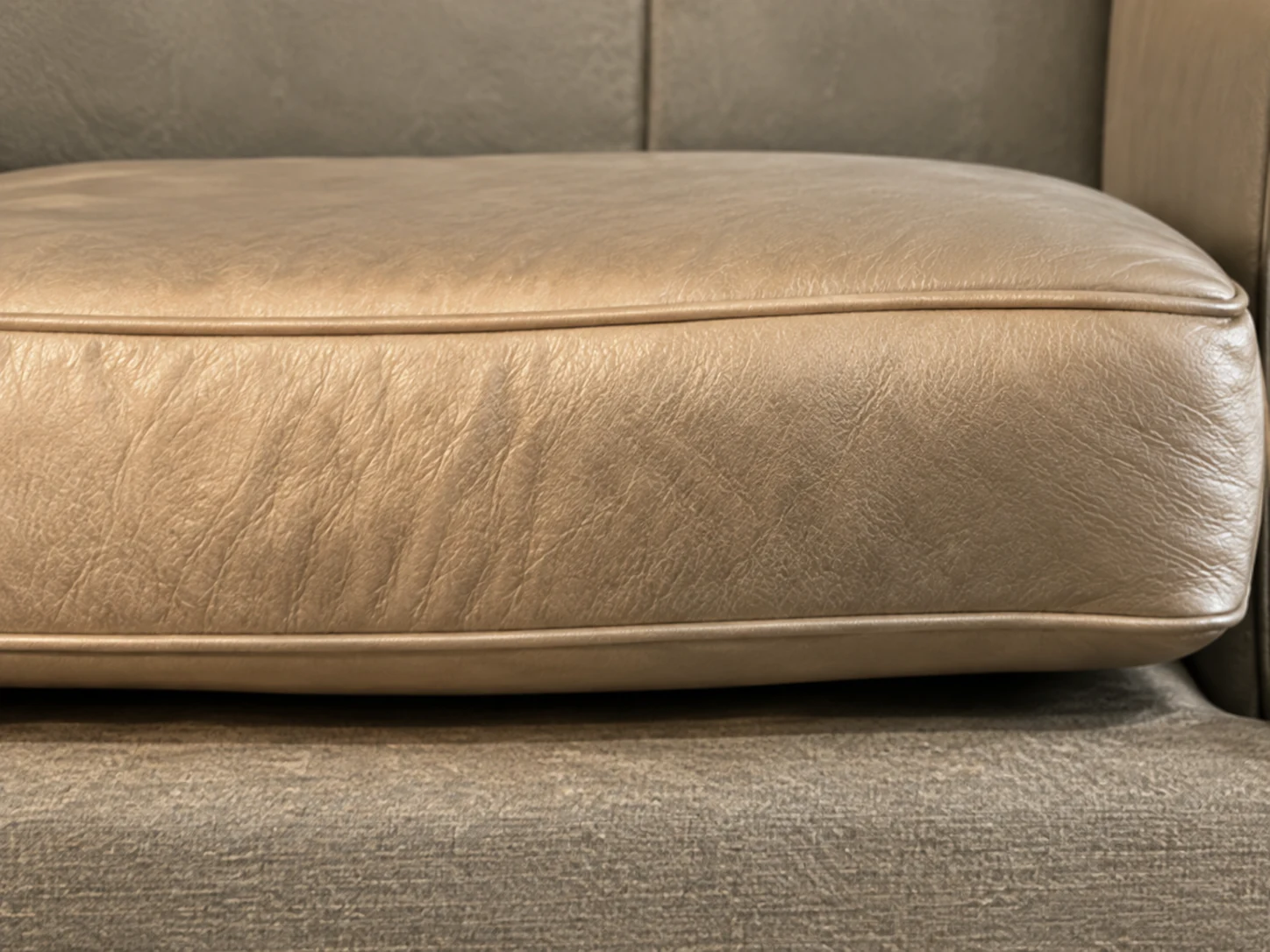 Flattened seat cushion with collapsed foam and a permanent seating dip