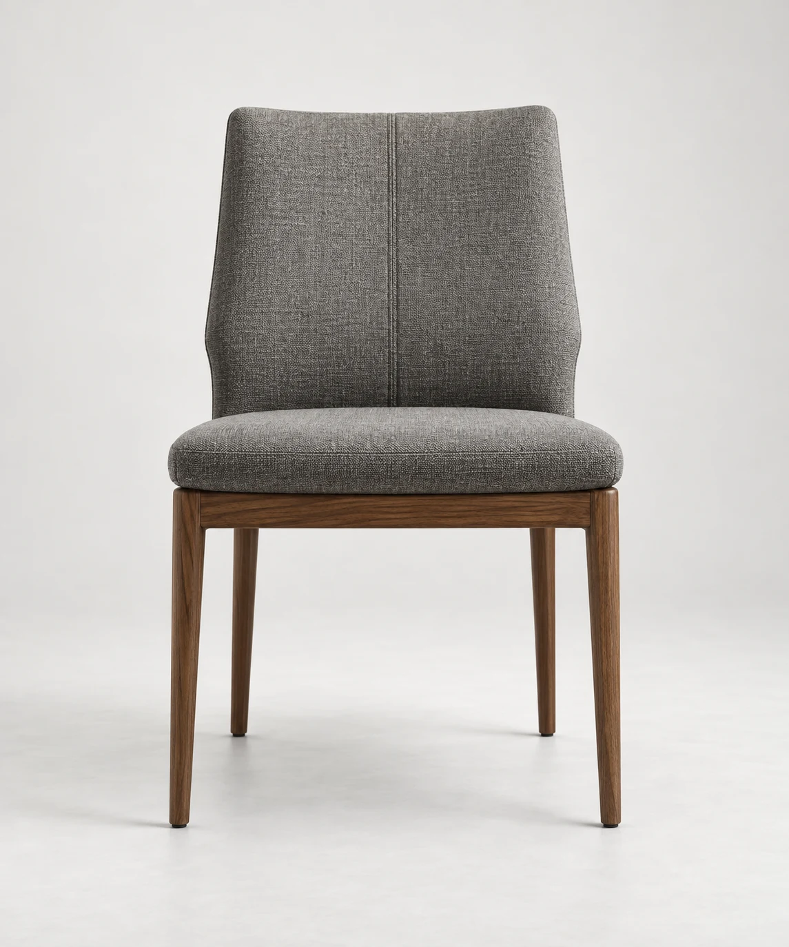 Grey fabric dining chair on tapered walnut legs