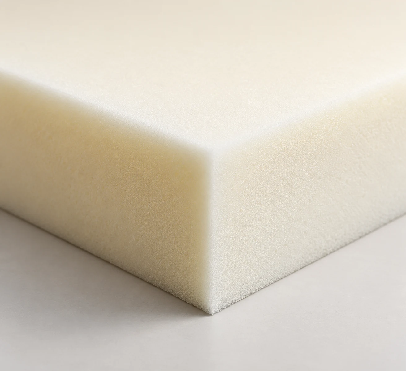 Solid high-resilience outdoor foam block with a closed, smooth cut face