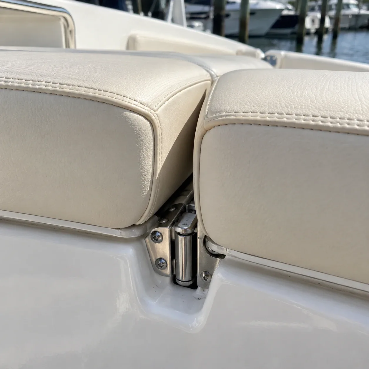 The gap between two hinged boat cushions where they fold together