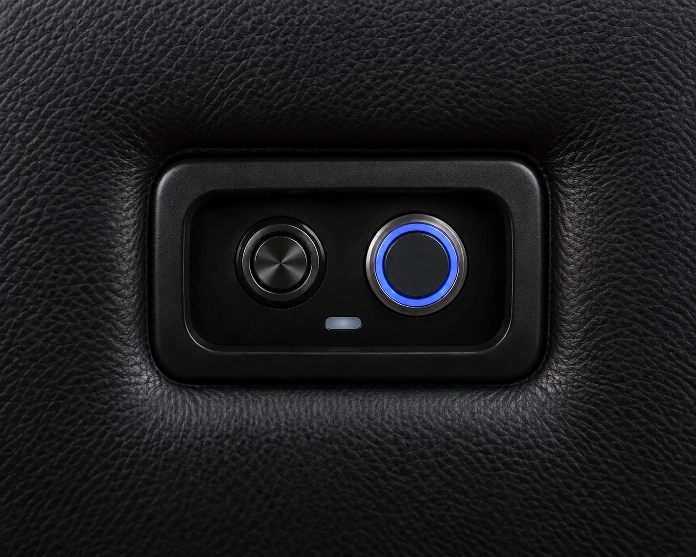 Illuminated power button on the recline control pad of a home theater seat arm