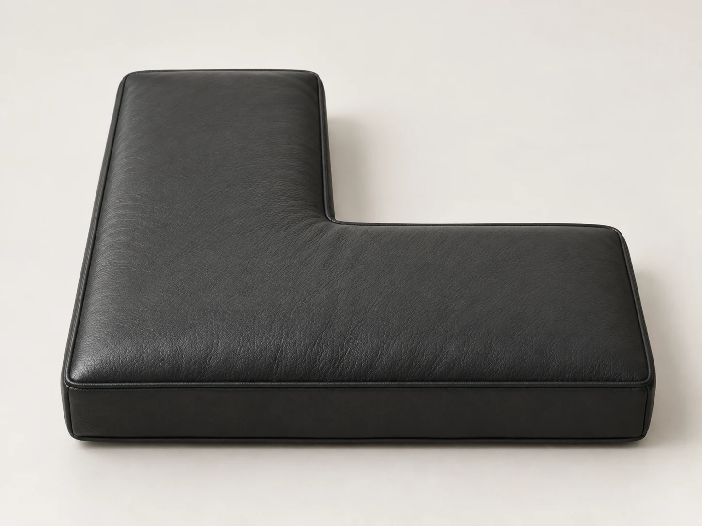 L-shaped seat cushion shape for a corner banquette return