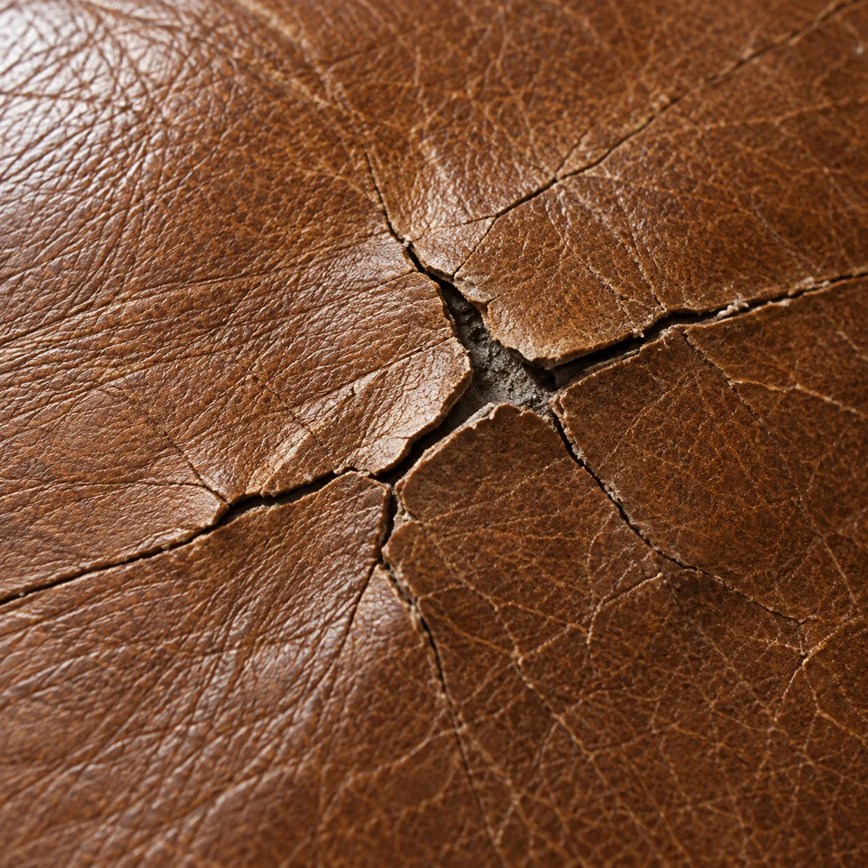 Leather split through to the backing