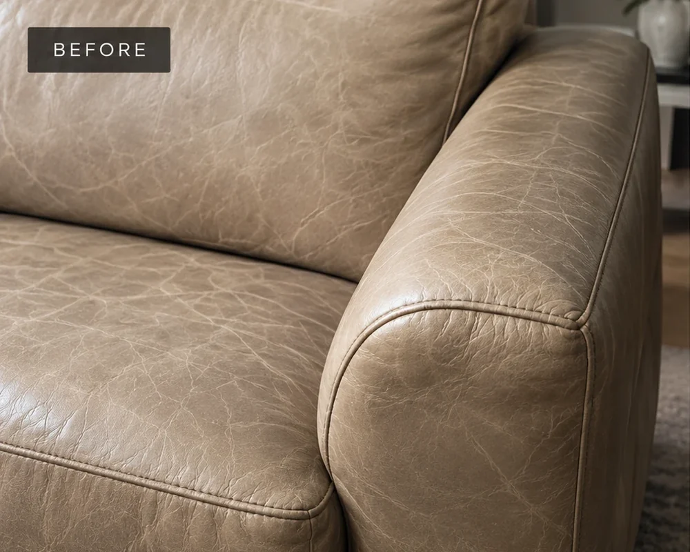 Taupe leather sofa arm dry and covered in a web of fine surface lines